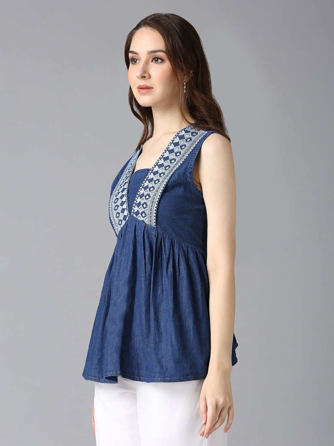 Side view of Cefalu Women's Blue Denim Sleeveless Top - Embroidered Detailing, Flowy Fit, Casual Wear
