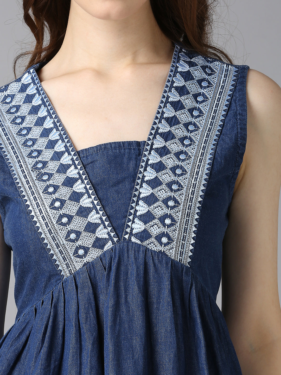 Close-up of Cefalu Women's Blue Denim Sleeveless Top - Intricate Embroidery and V-Neck Design