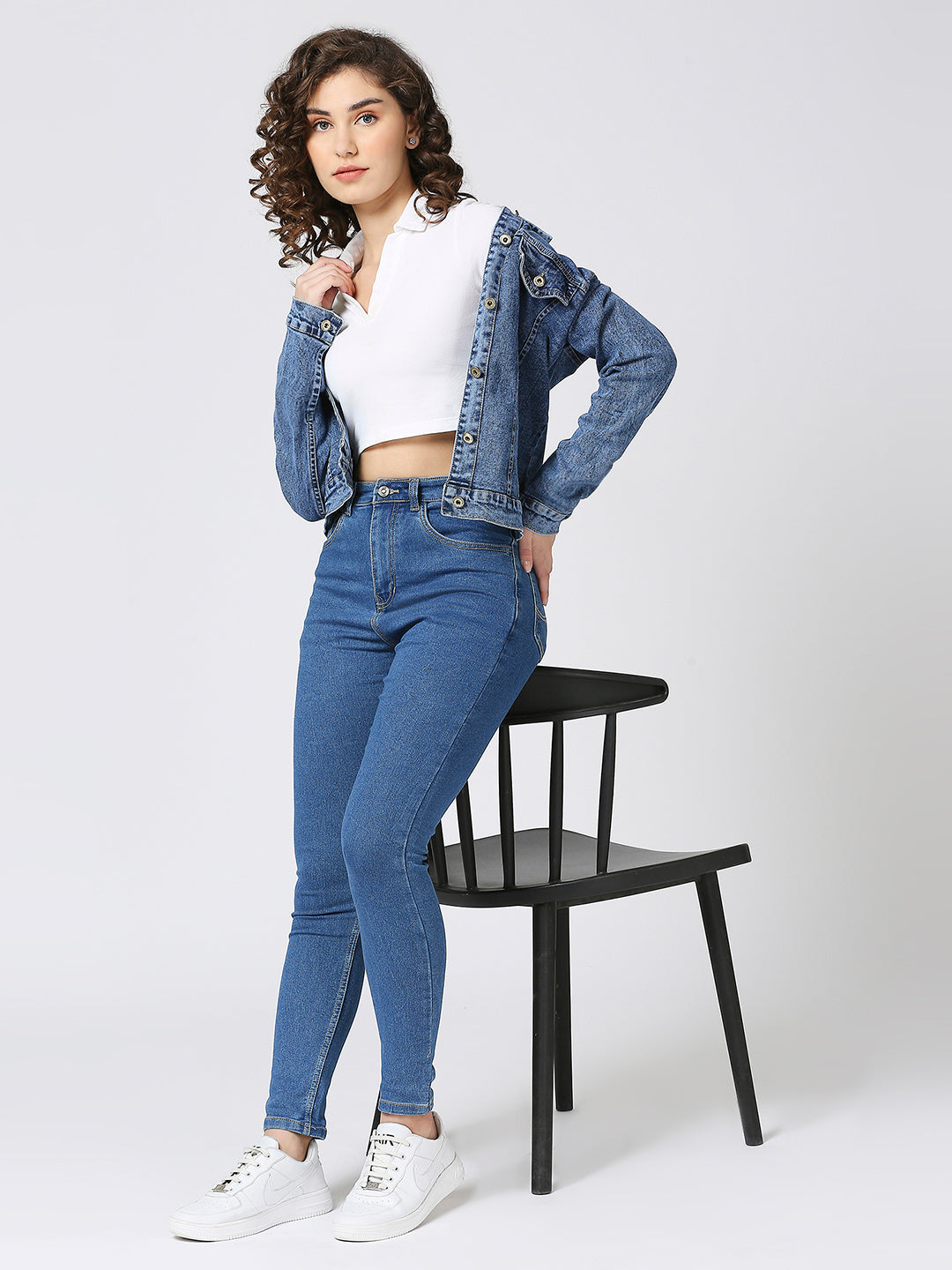 Pair of Cefalu high-waisted skinny jeans for women in a solid pattern, featuring a high rise, skinny fit, and multiple pockets. Made from a blend of cotton, polyester, and elastane
