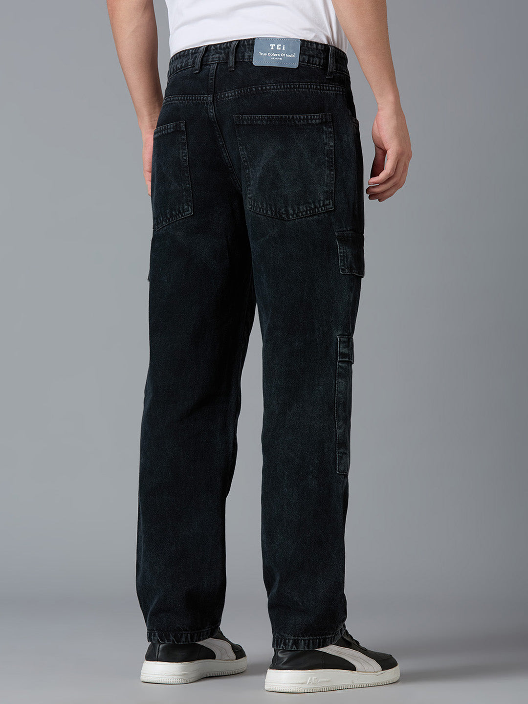 Back view of TCI Men's Black Cargo Jeans - Elastic Waistband with Functional Pockets