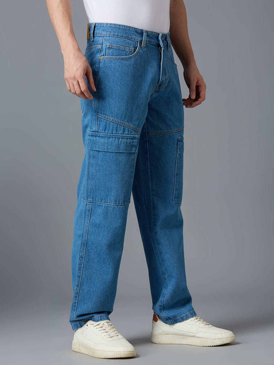 Angled view of TCI Men's Wash Blue Cargo Denim Pants - Stylish & Comfortable for Casual Wear