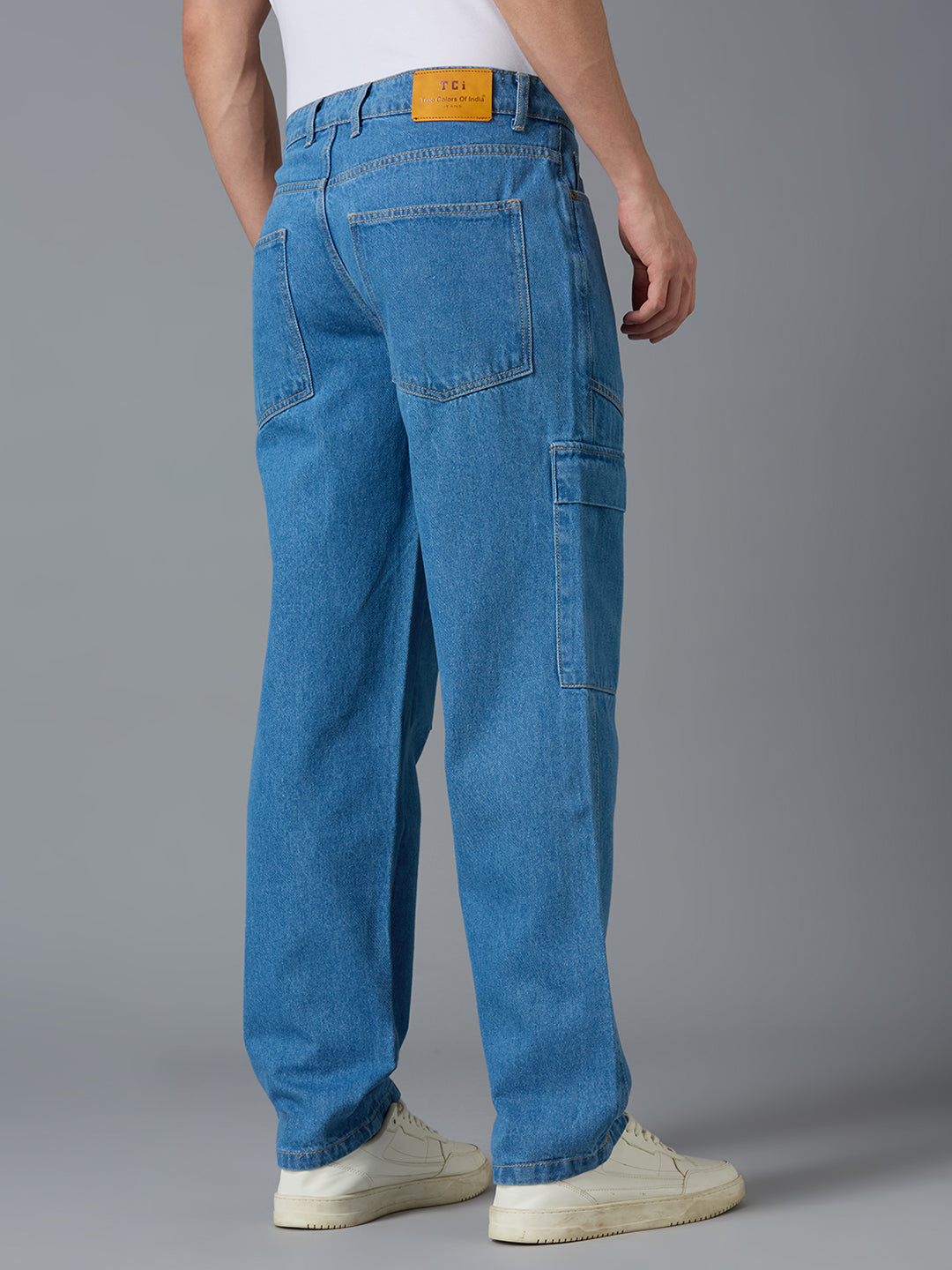 Back view of TCI Men's Blue Cargo Jeans - Classic Button Closure with Functional Pockets