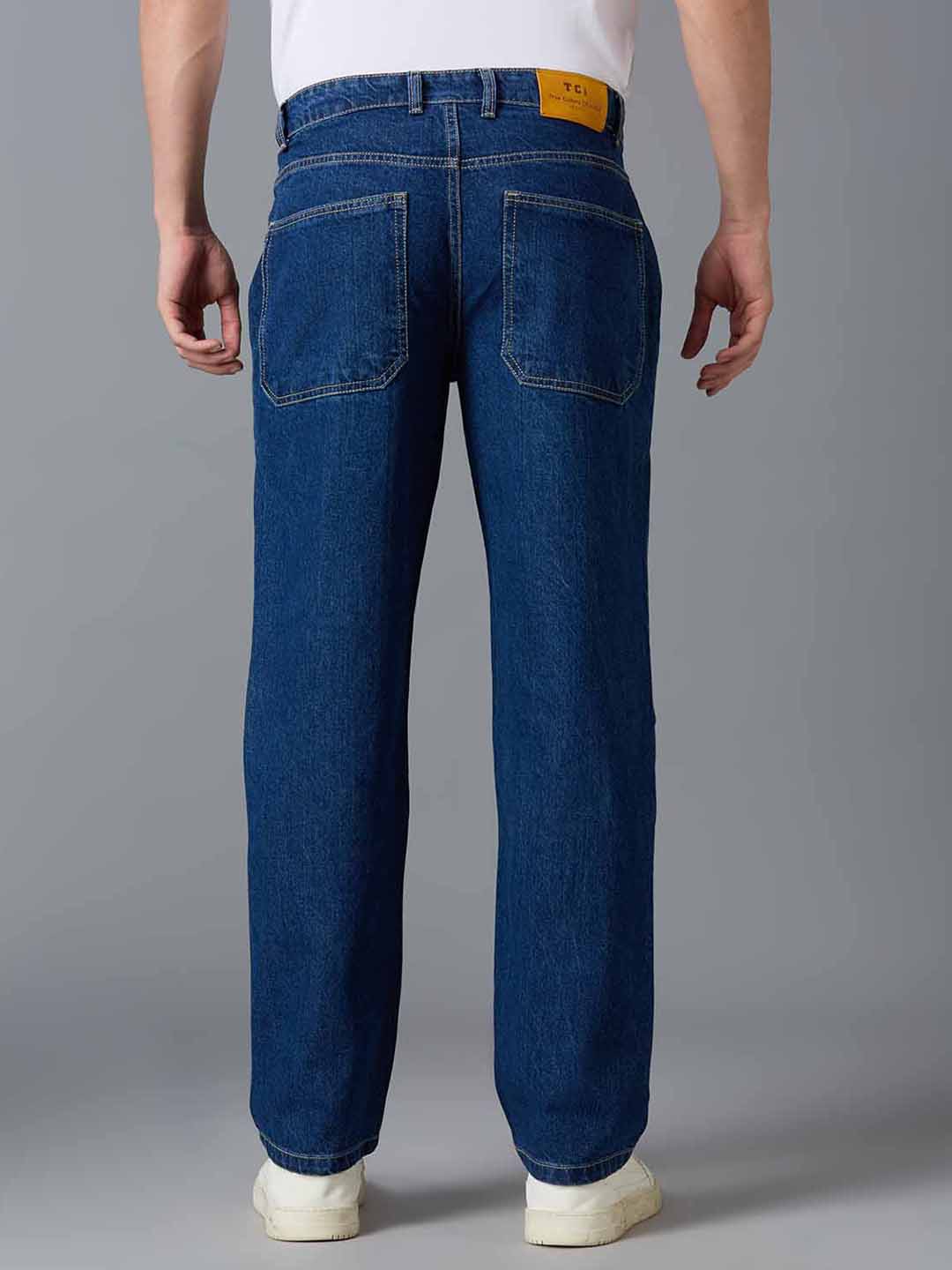 Back view of TCI Men's Ink Blue Cargo Jeans - Classic Button Closure with Functional Pockets