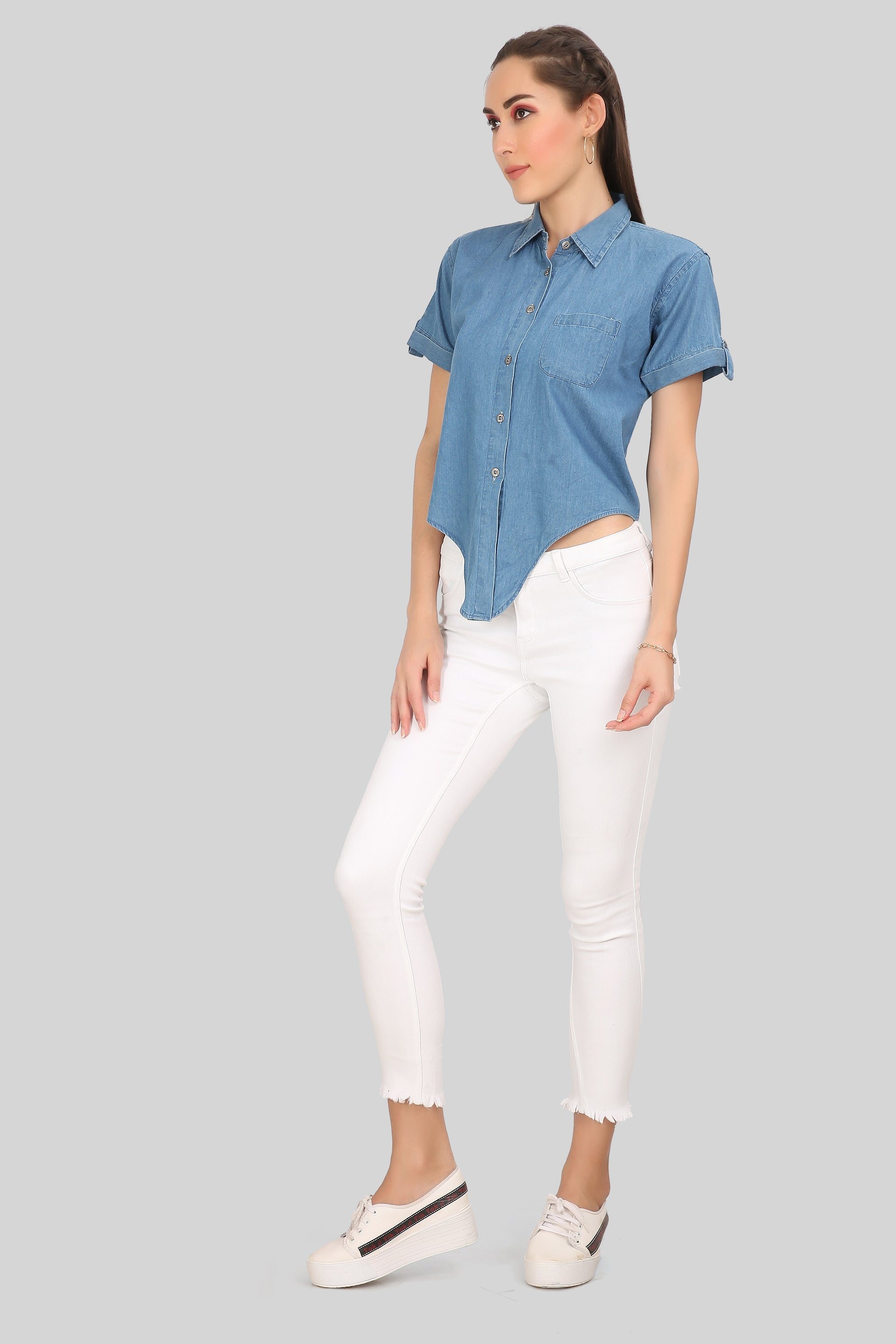 Side view of Cefalu Women’s Blue Denim Shirt showing half sleeves and left side pocket.