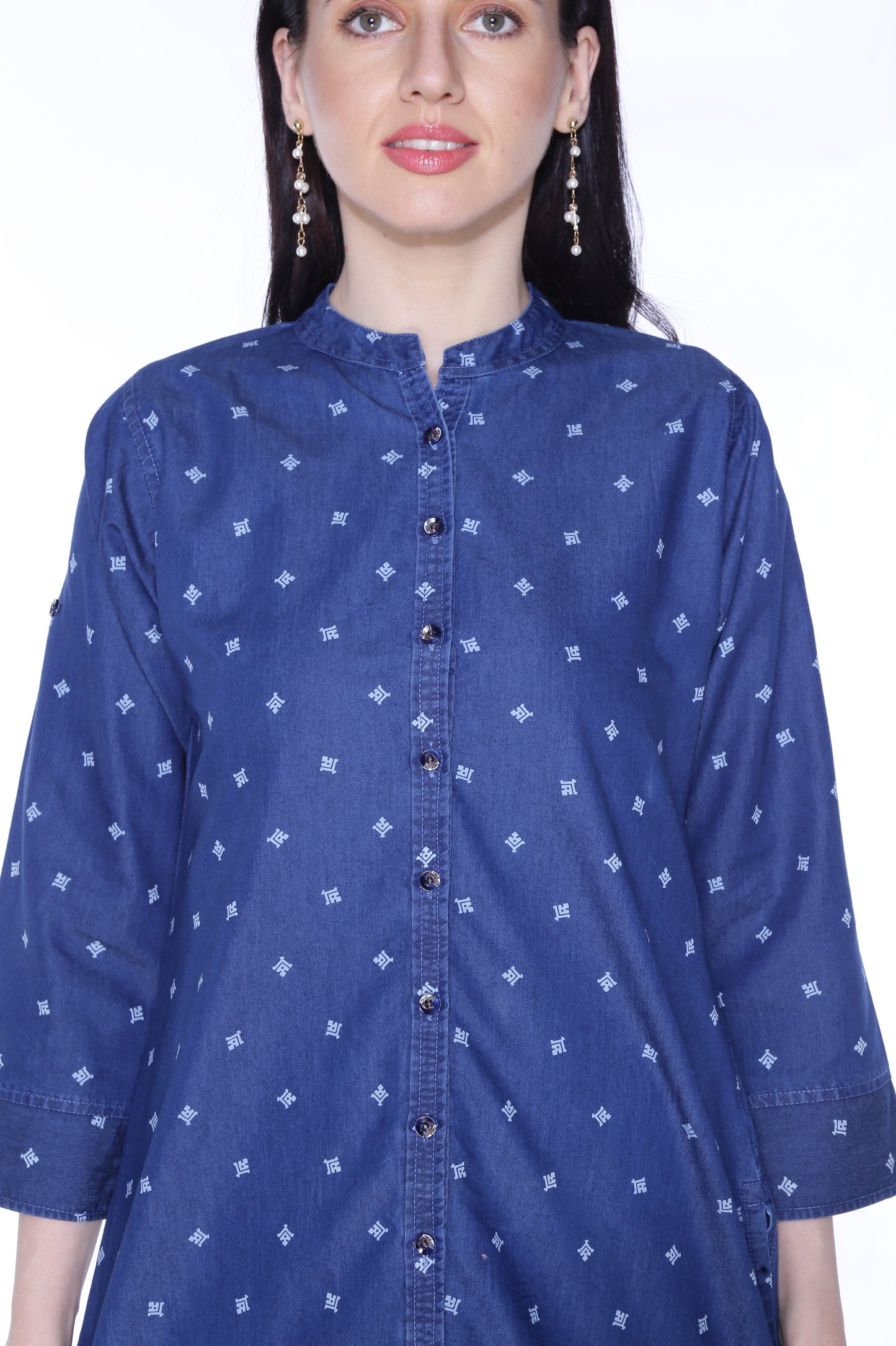 Closeup of Cefalu®️ Women's Blue Printed Denim Kurti fabric, showcasing the printed design and cotton blend texture.