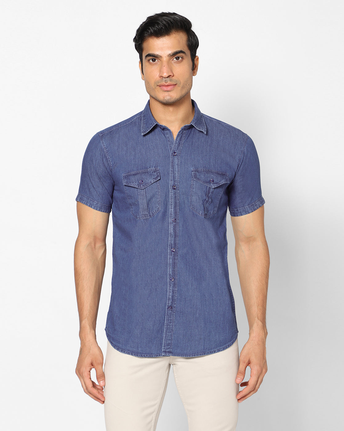Front view of the TCI Men’s mid blue cotton denim shirt, featuring a regular fit, half sleeves, and spread collar.