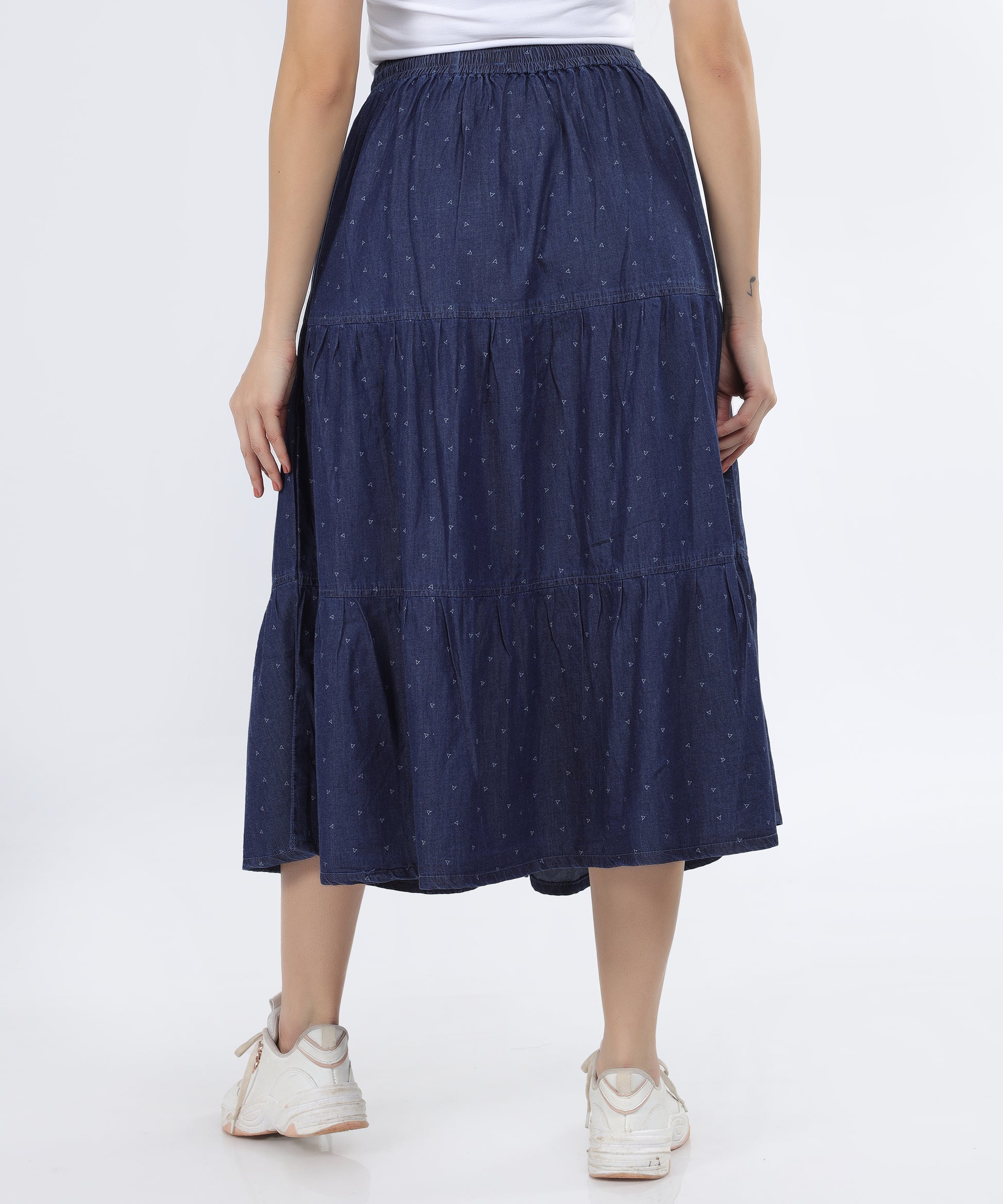Back view of the Cefalu Women’s Denim Skirt in blue, showing the tiered design and calf-length fit.