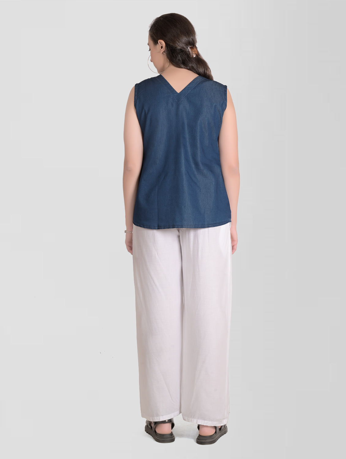 Back view of Cefalu Women’s Blue Denim Top demonstrating the regular fit and overall design.