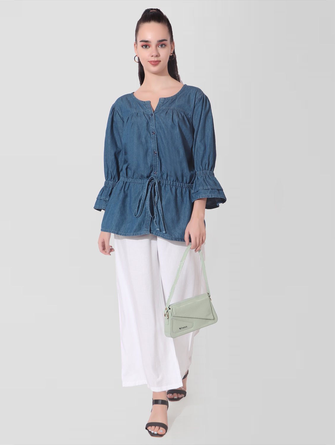 Model wearing Casual Bell Sleeves Women’s Blue Denim Top, featuring bell sleeves, waist fit extension Dori, and Henley neck.