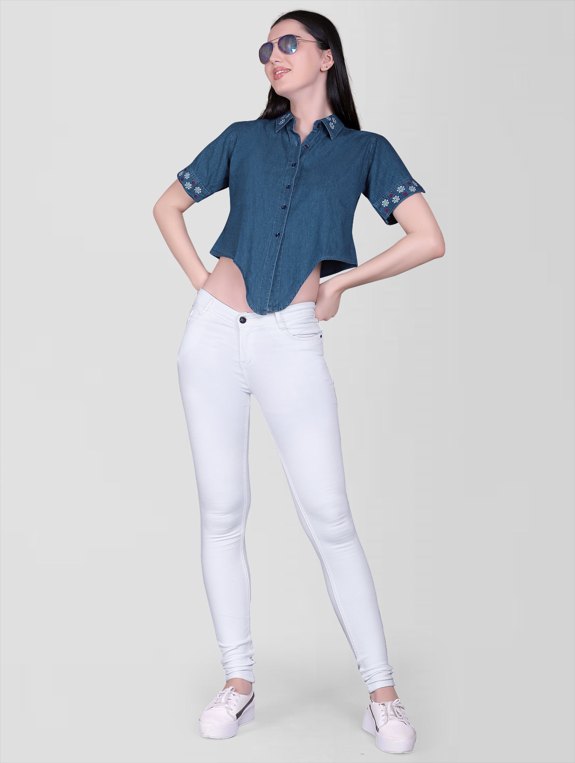 Model wearing Women’s Blue Denim Embroidered Shirt Top, showcasing the collared design, knotted front, and half sleeves.