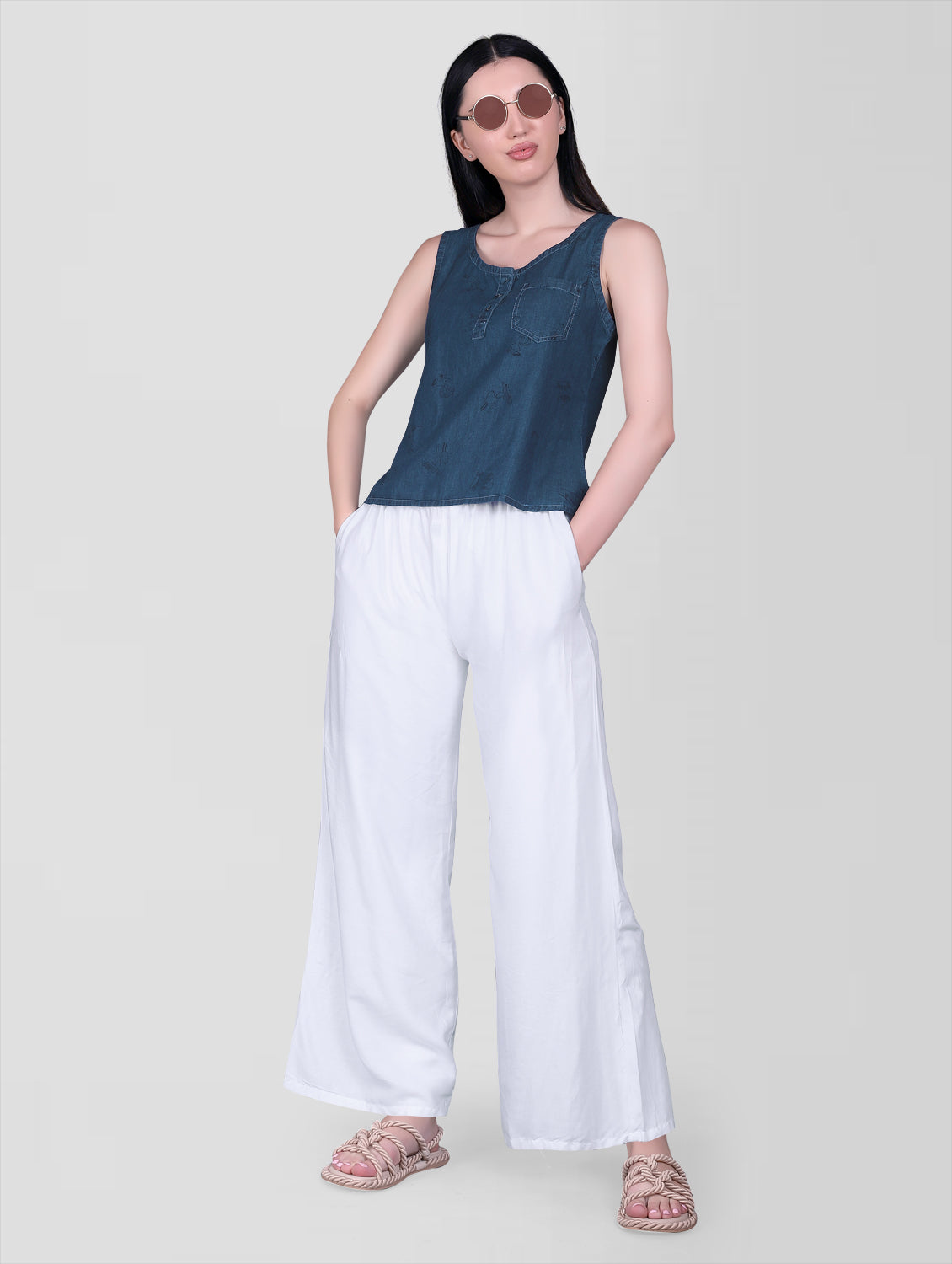 Model wearing Cefalu Women’s Blue Denim Crop Top, showing the stylish fit and animal print design.