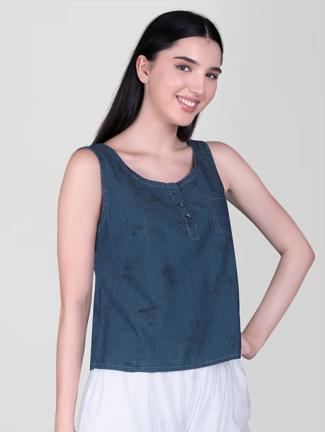 Side view of Cefalu Women’s Blue Denim Crop Top featuring the sleeveless design and round neckline.