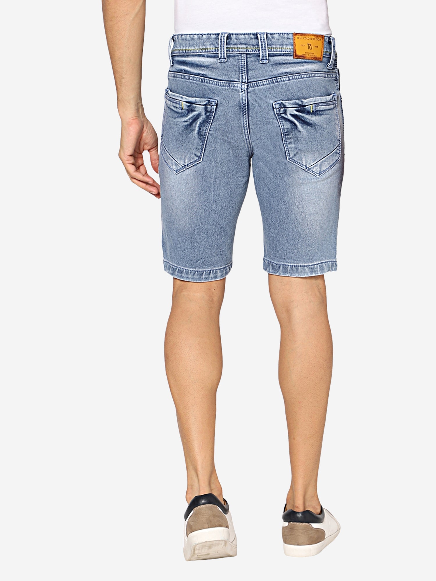 Back view of TCI Men’s Light Blue Denim Shorts, highlighting the design of the back pockets and slim fit.