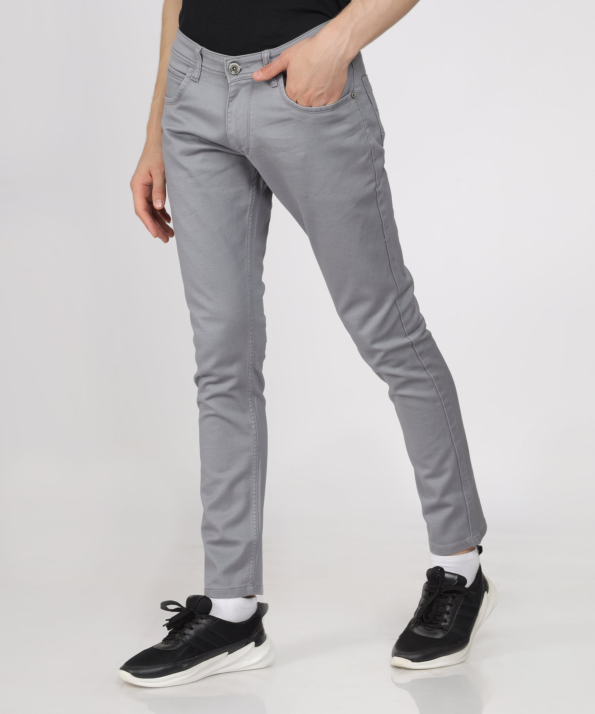 Detail of the button closure on TCI Men’s Light Grey Trousers.