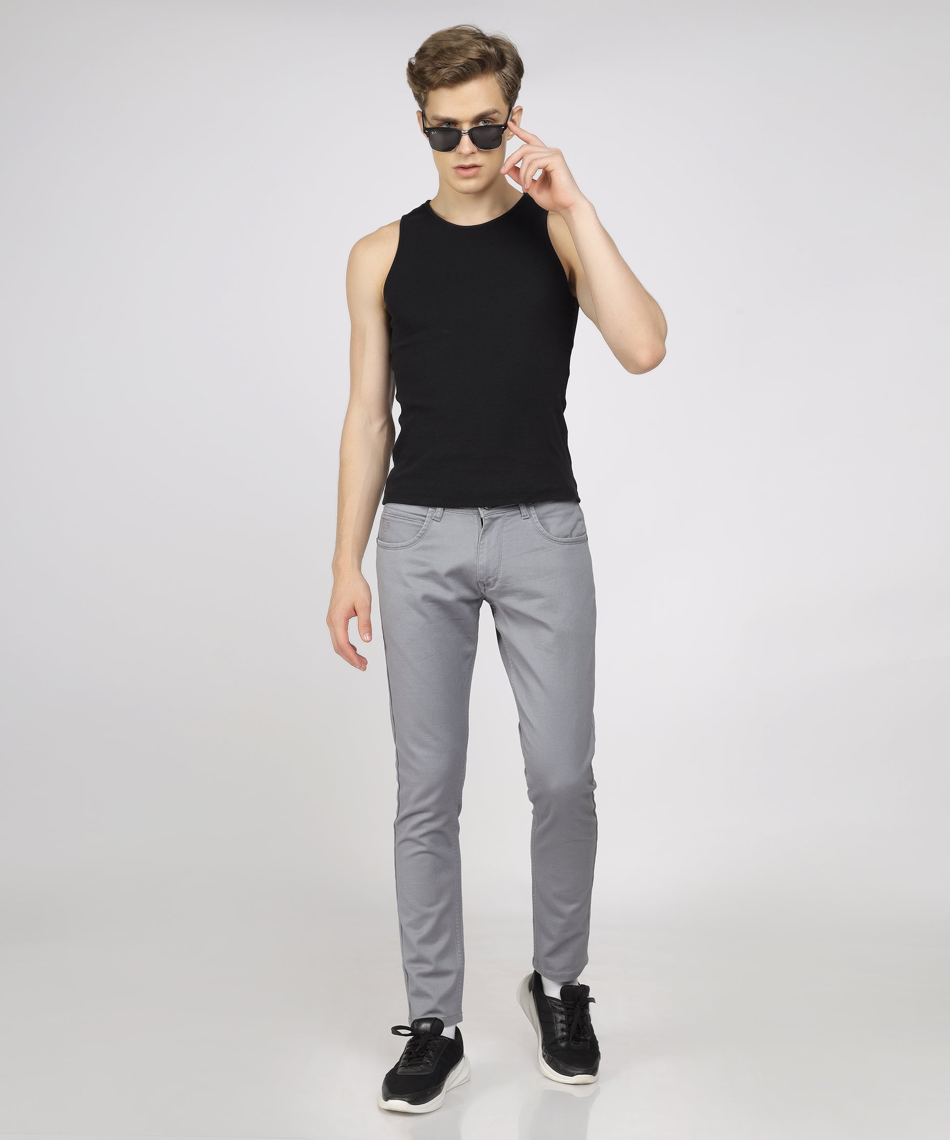 Model showcasing TCI Light Grey Trousers styled for a formal occasion.