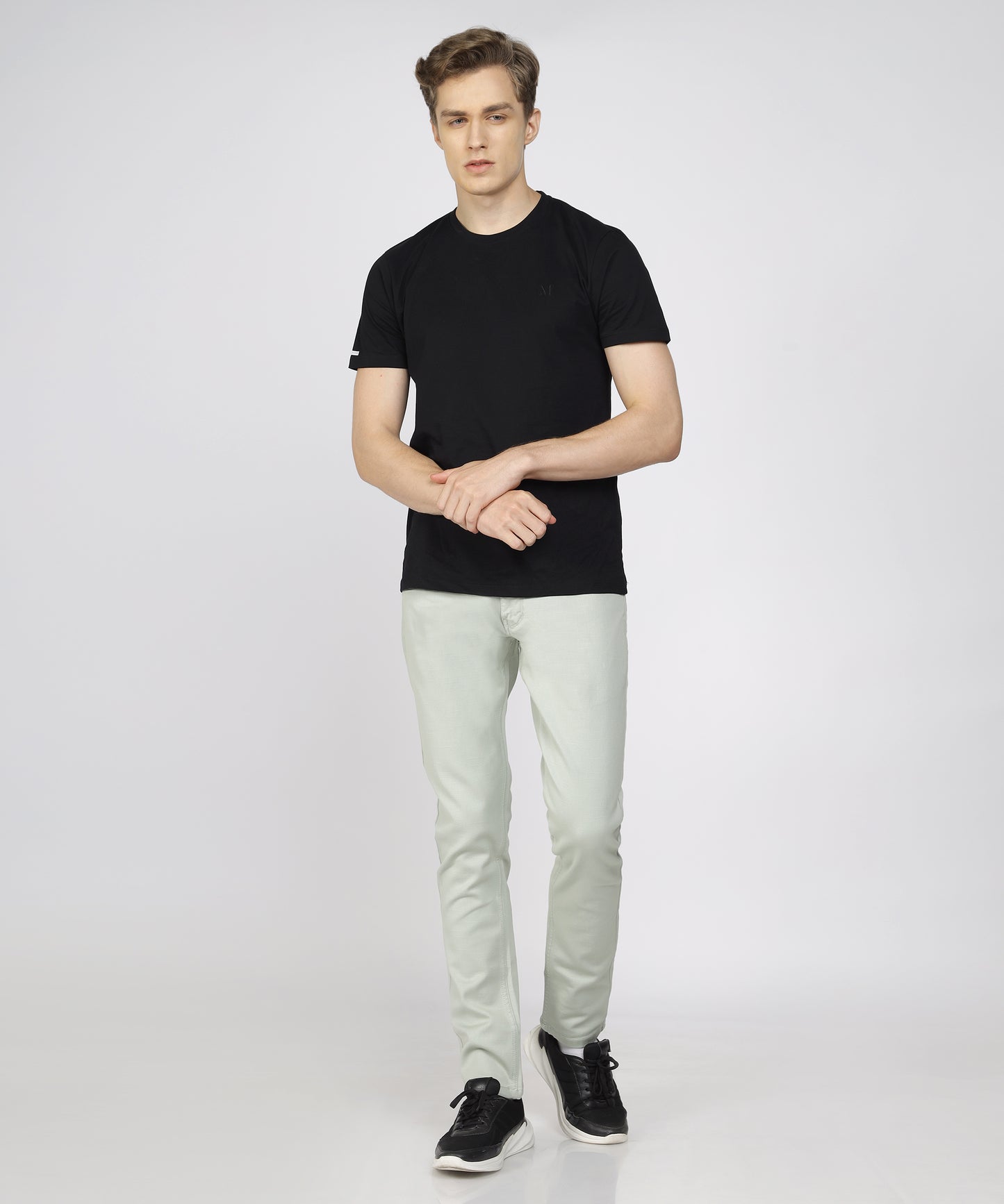 Model showcasing TCI Steel Grey Trousers styled for a business event.