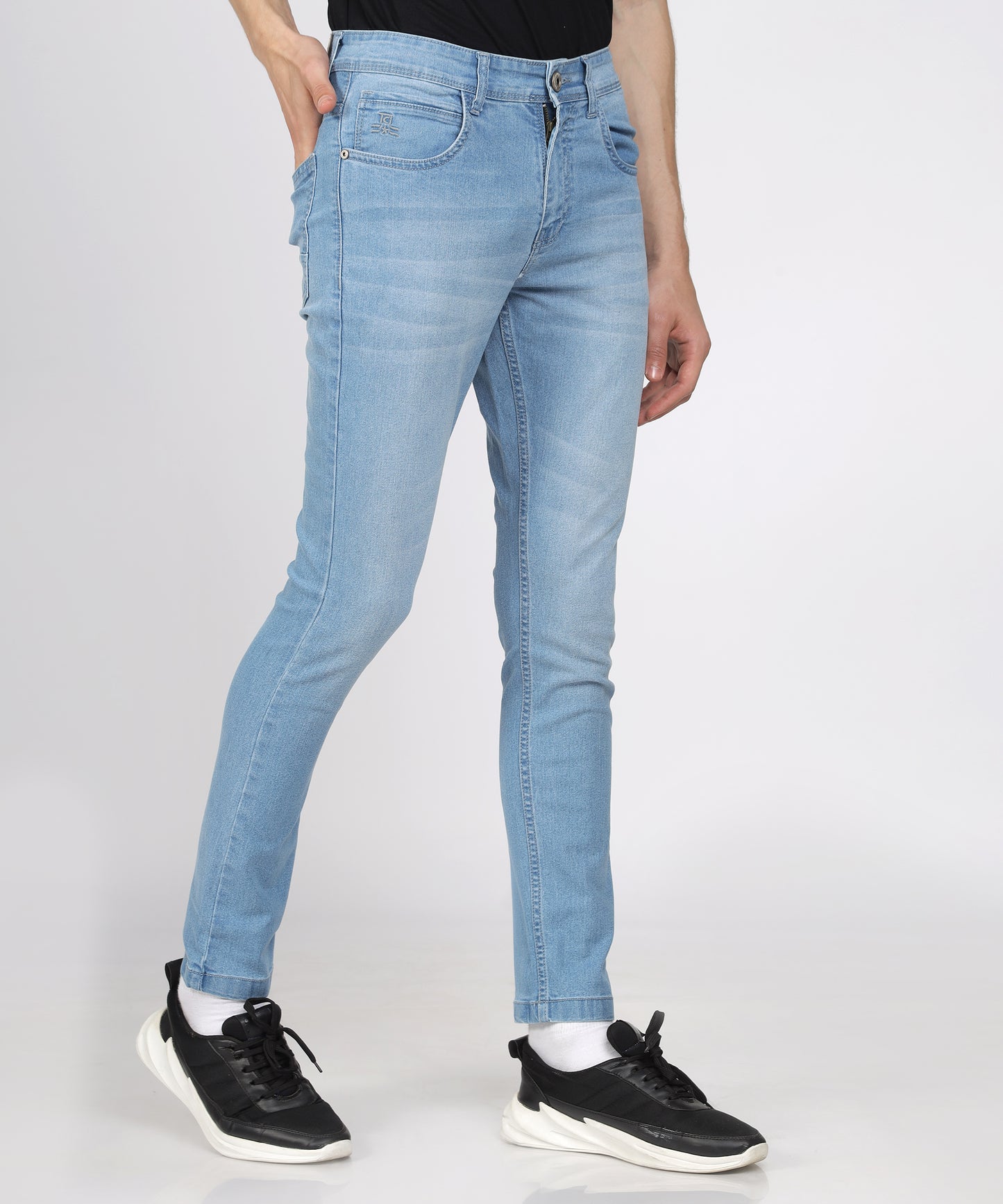 Close-up of the button closure and zip fly on TCI Men’s Jeans.