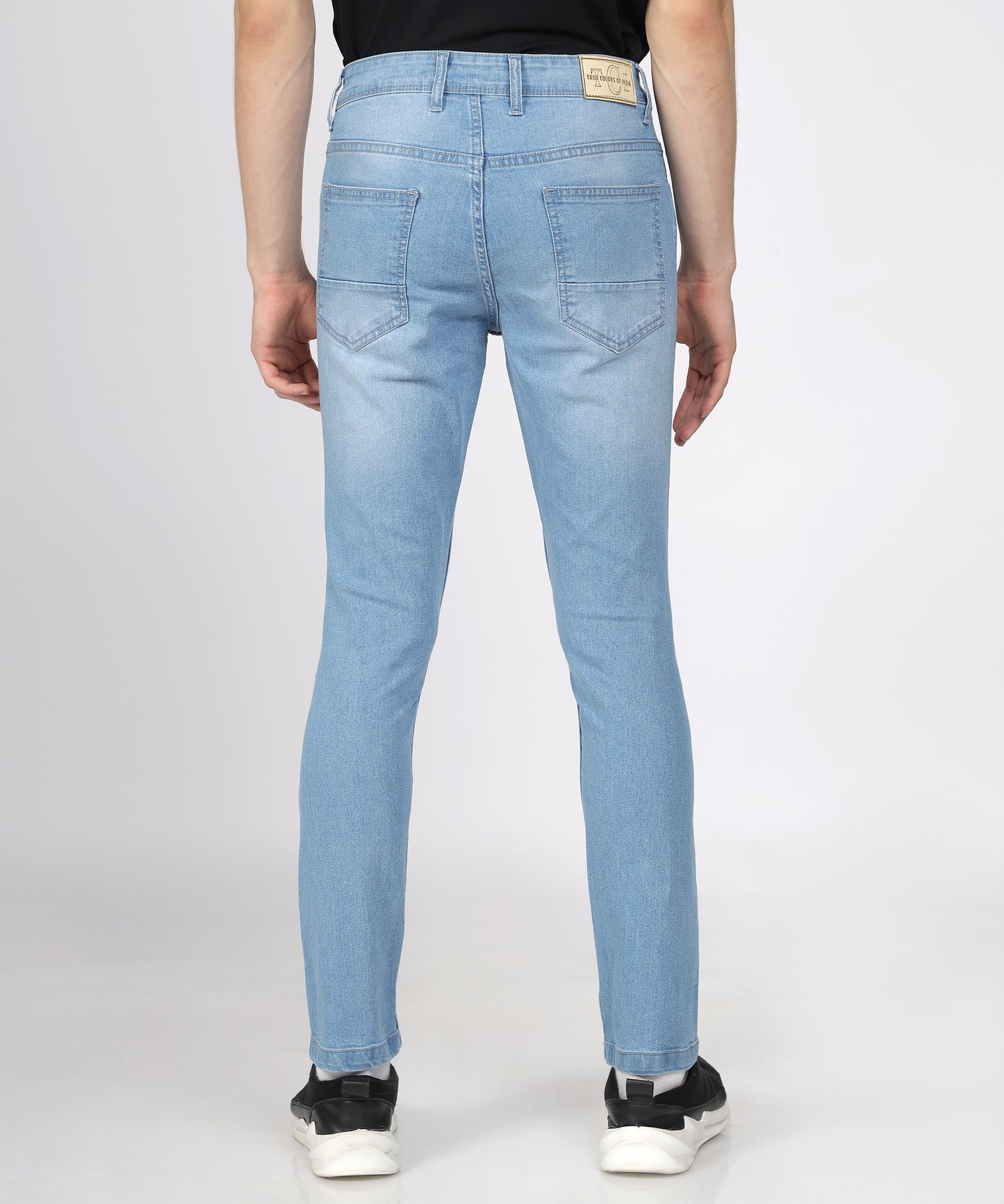 Back view of Fabric texture of TCI Men’s Light Blue Slim Fit Jeans highlighting stretchability.