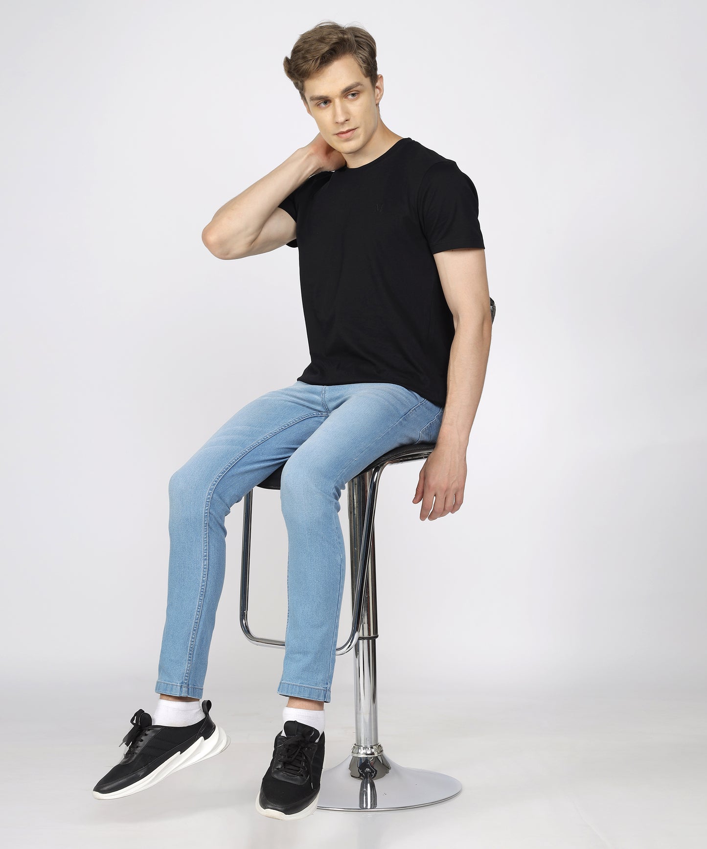 Model showcasing TCI Men’s Light Blue Jeans styled for casual wear.