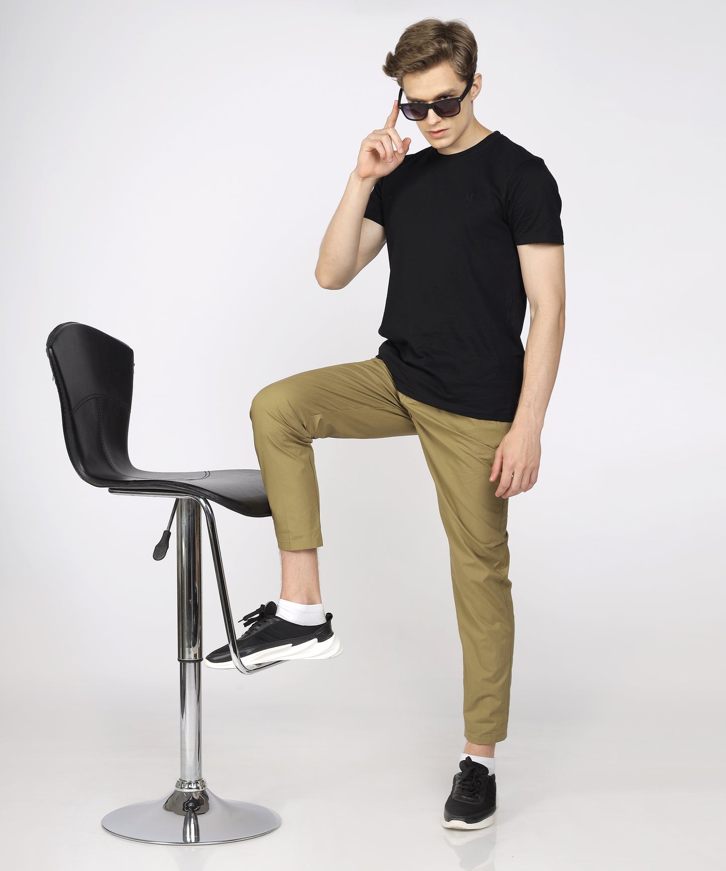 Model showcasing TCI Khaki Cotton Trouser styled for casual wear.