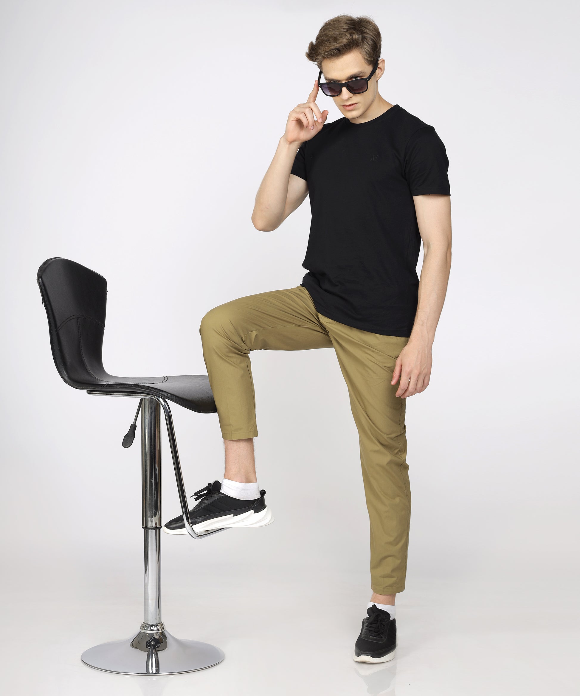 Model showcasing TCI Khaki Cotton Trouser styled for casual wear.