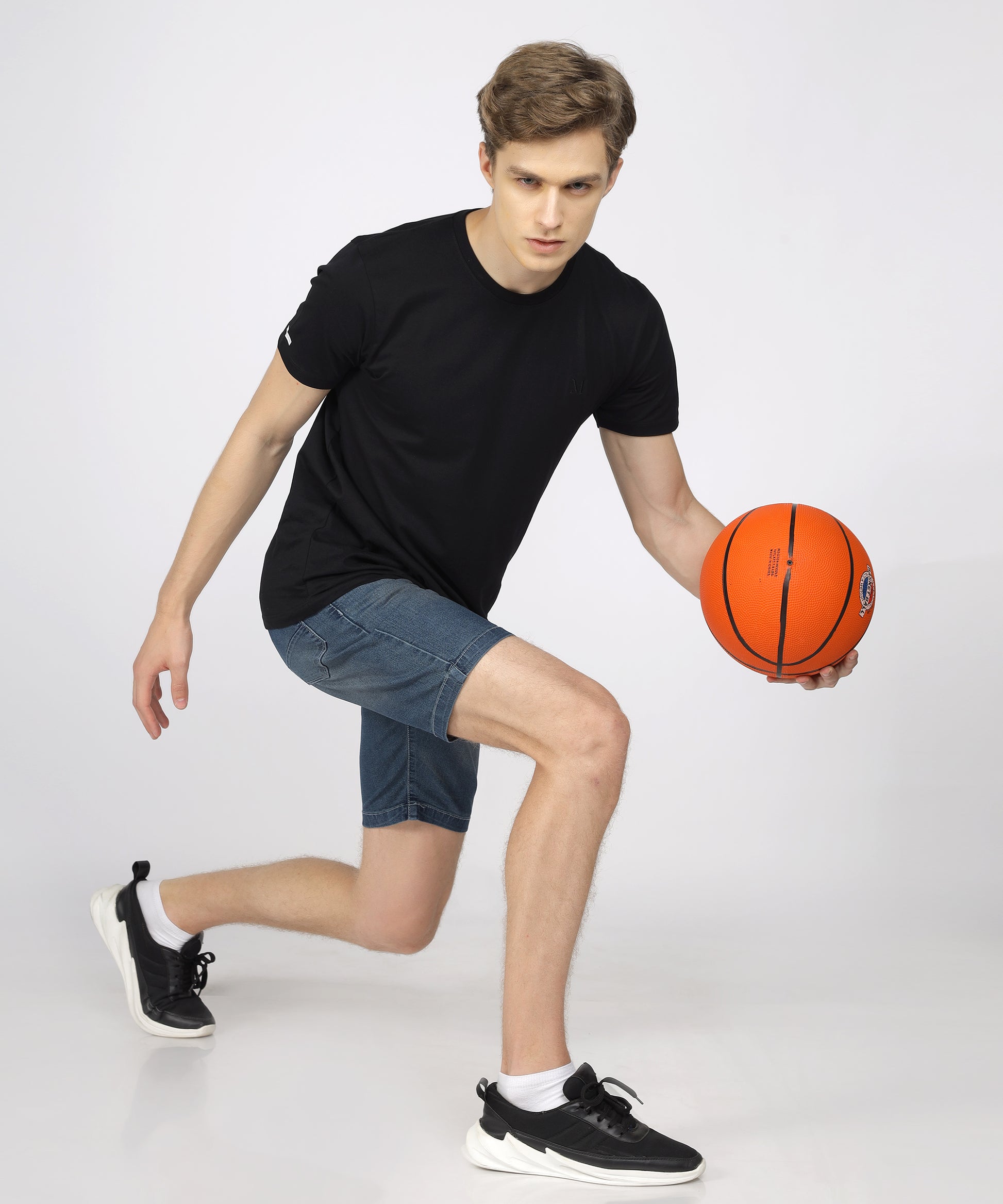 Model showcasing TCI Men’s Corbon Blue Shorts styled for casual wear.