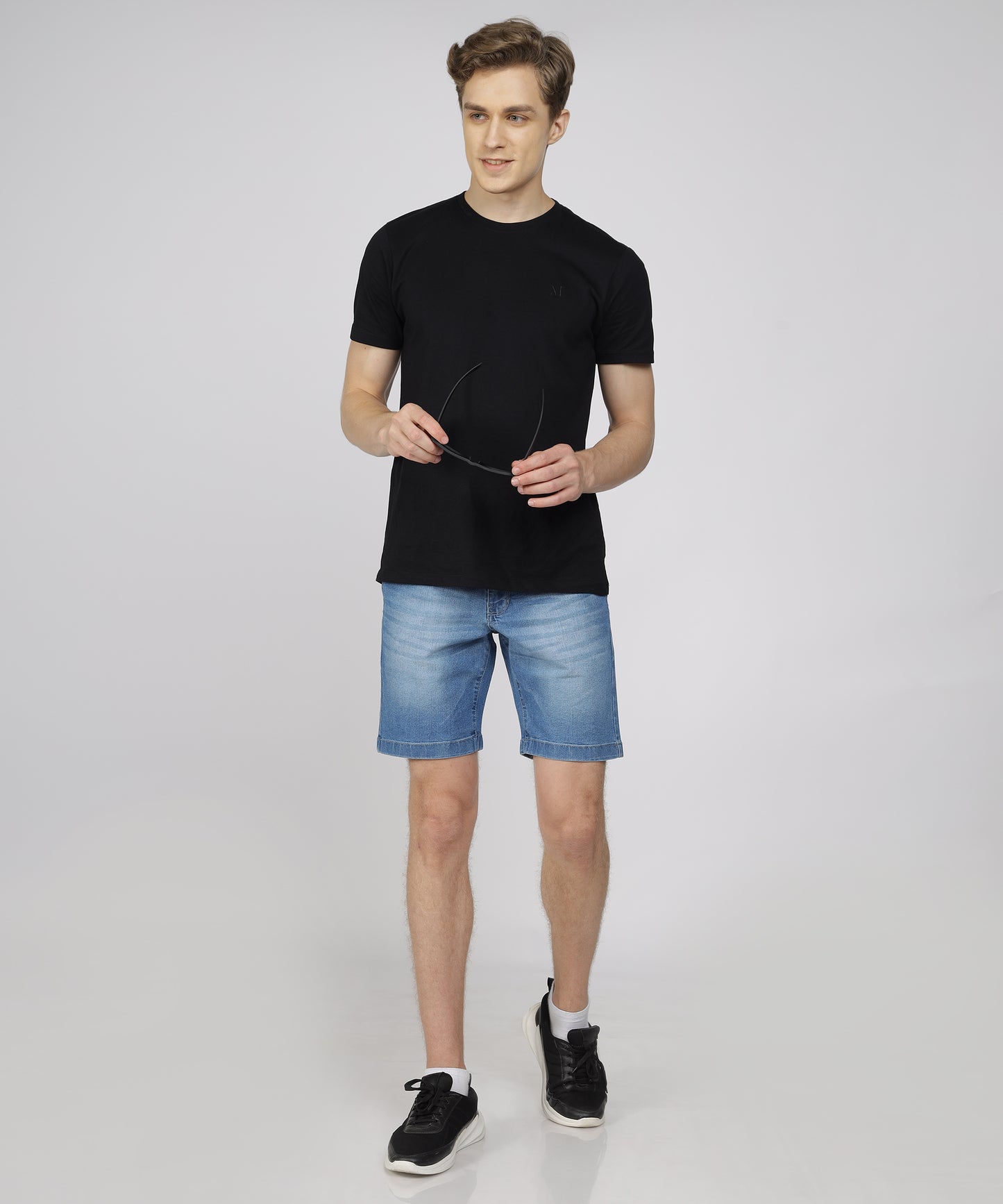 Model showcasing TCI Men’s Light Blue Shorts styled for casual wear.