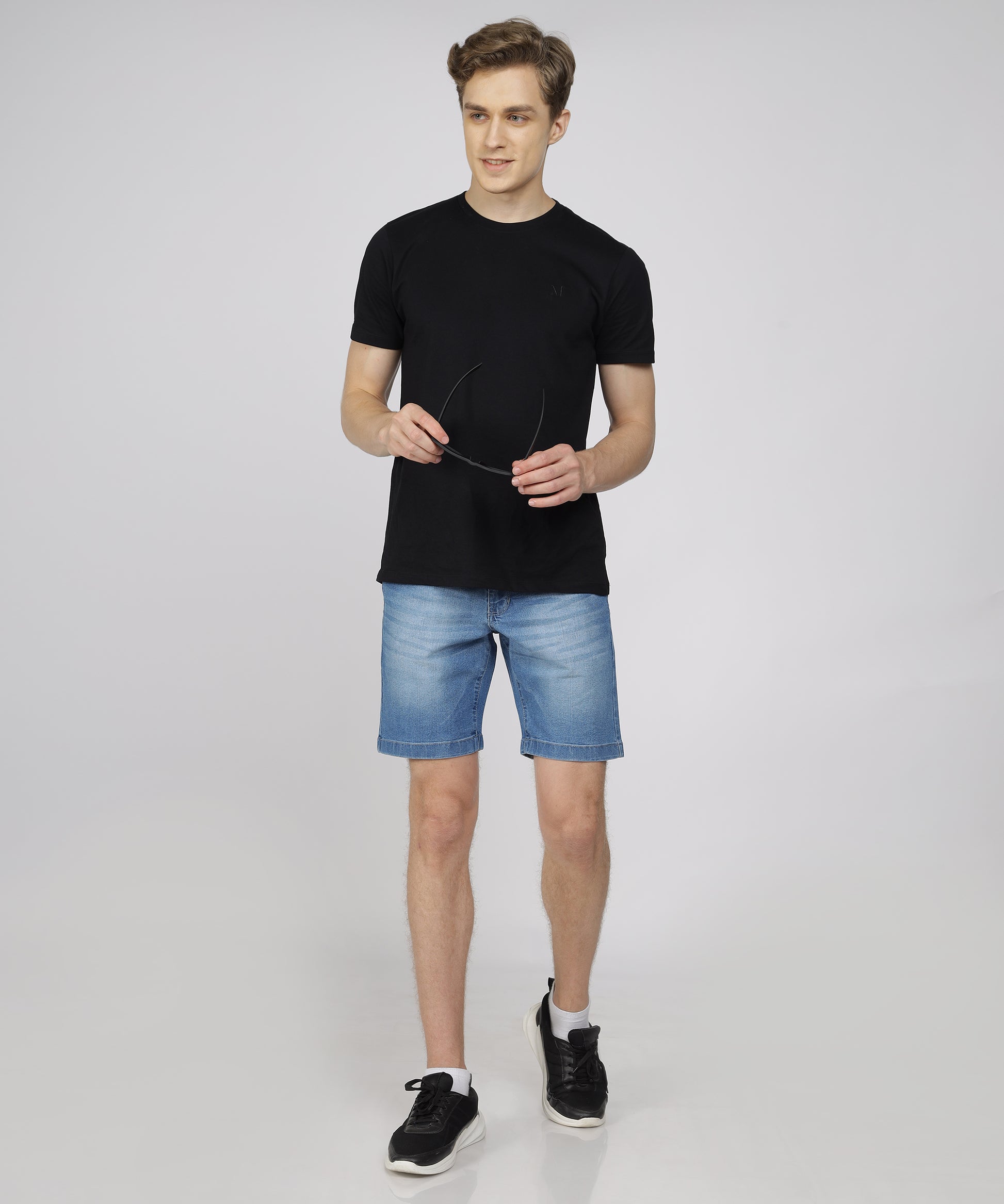 Model showcasing TCI Men’s Light Blue Shorts styled for casual wear.