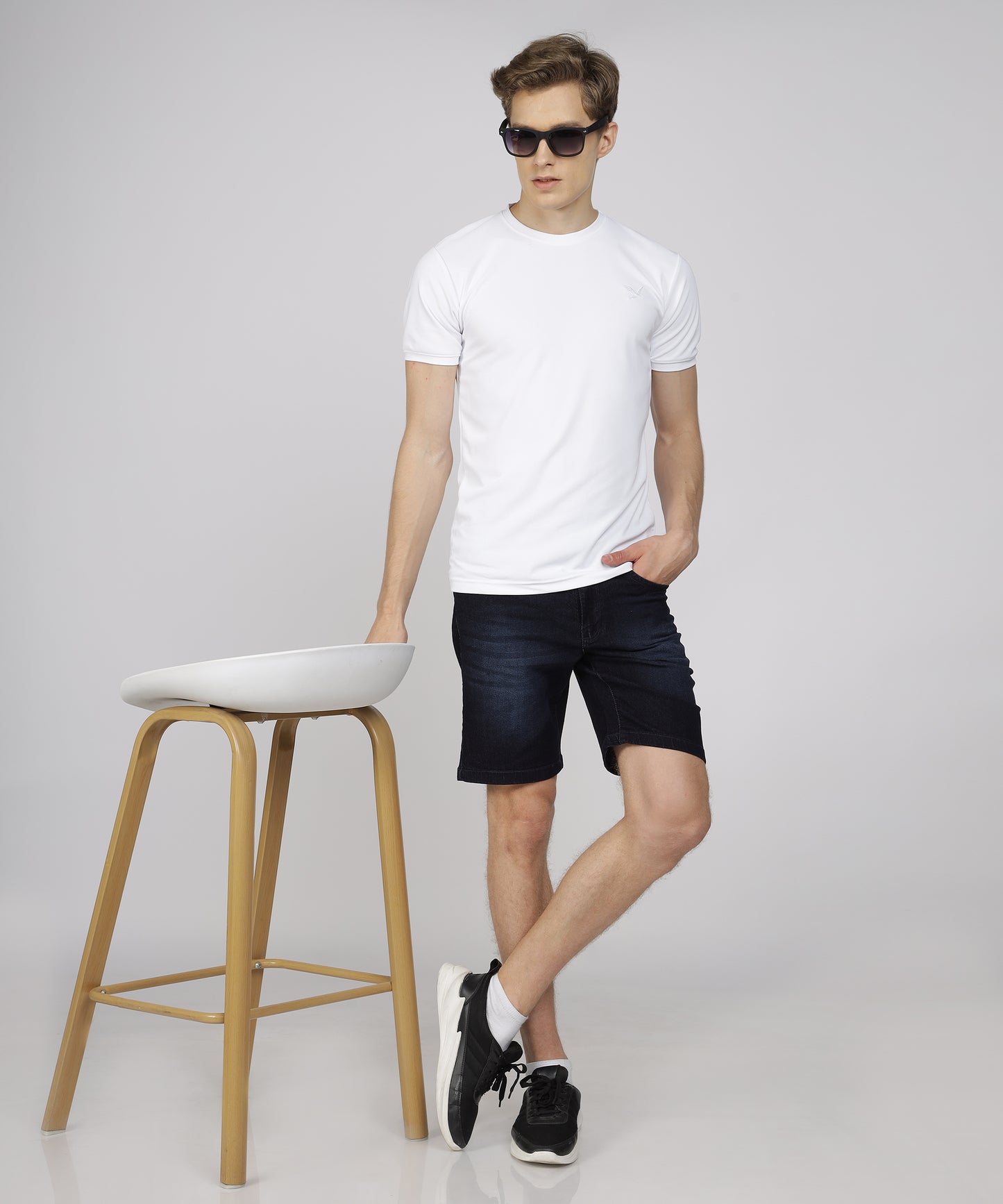 Model showcasing TCI Men’s Nevy Blue Shorts styled for casual wear.