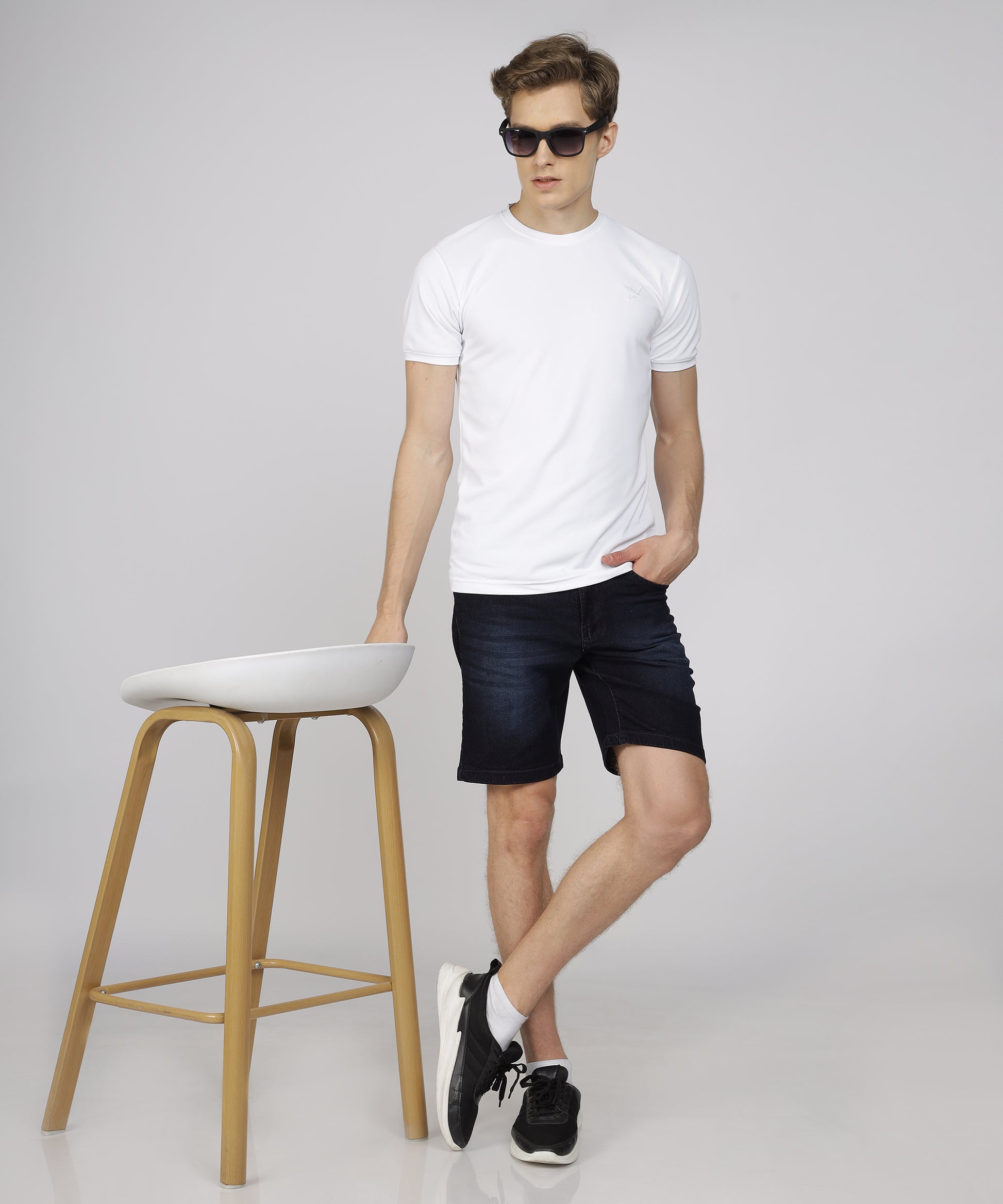 Model showcasing TCI Men’s Nevy Blue Shorts styled for casual wear.