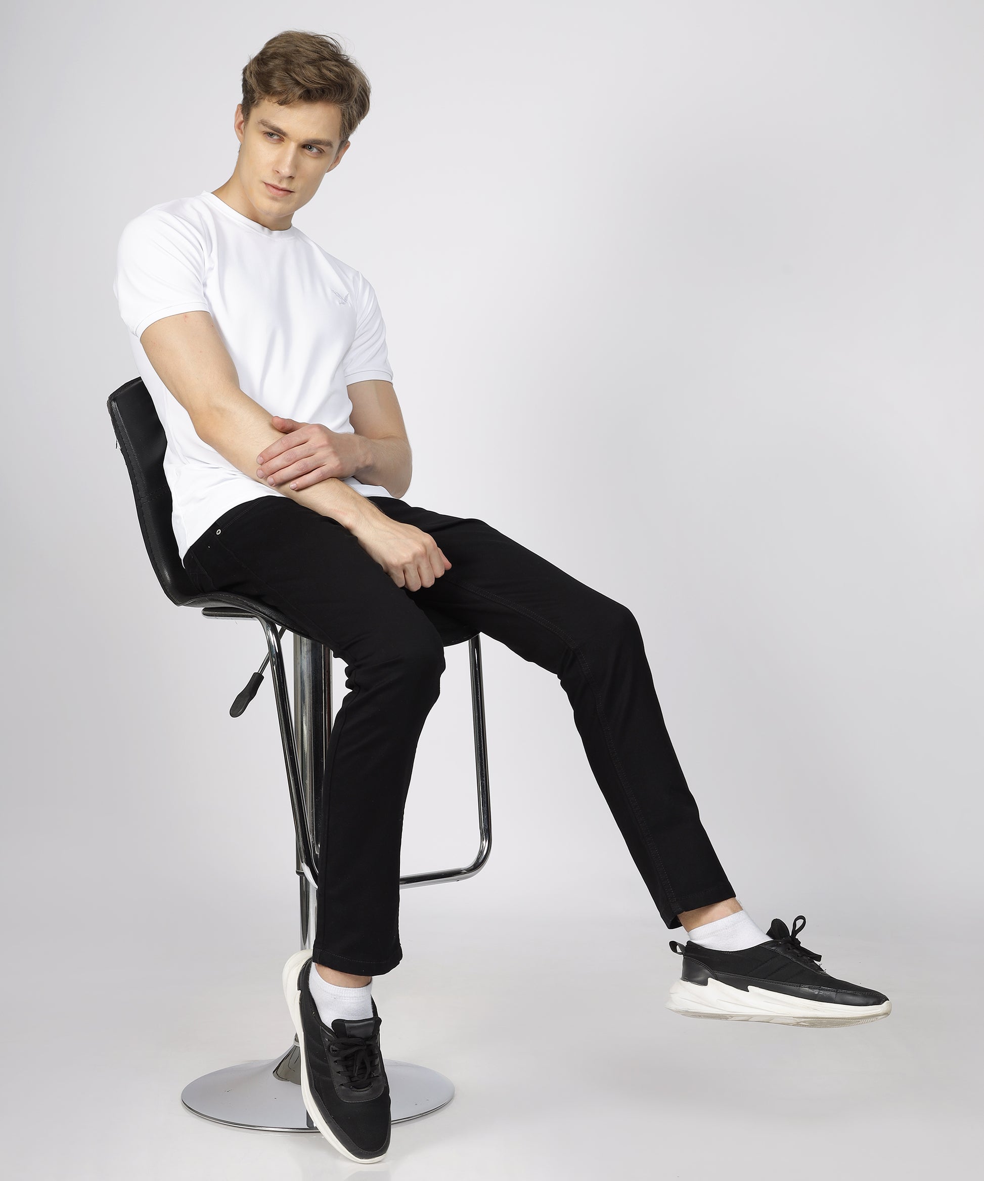 Model showcasing TCI Black Trousers styled for a business meeting.