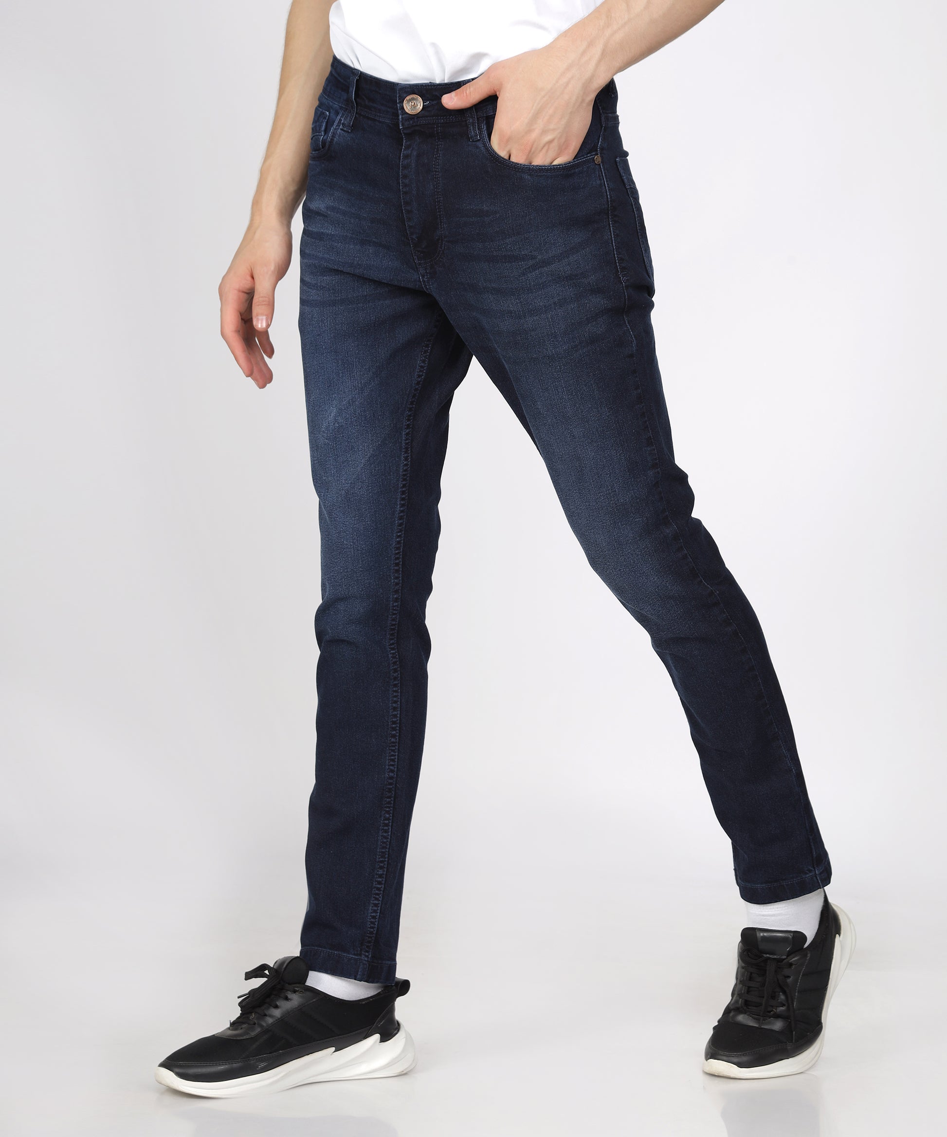 Close-up of the button closure and zip fly on TCI Men’s Jeans.