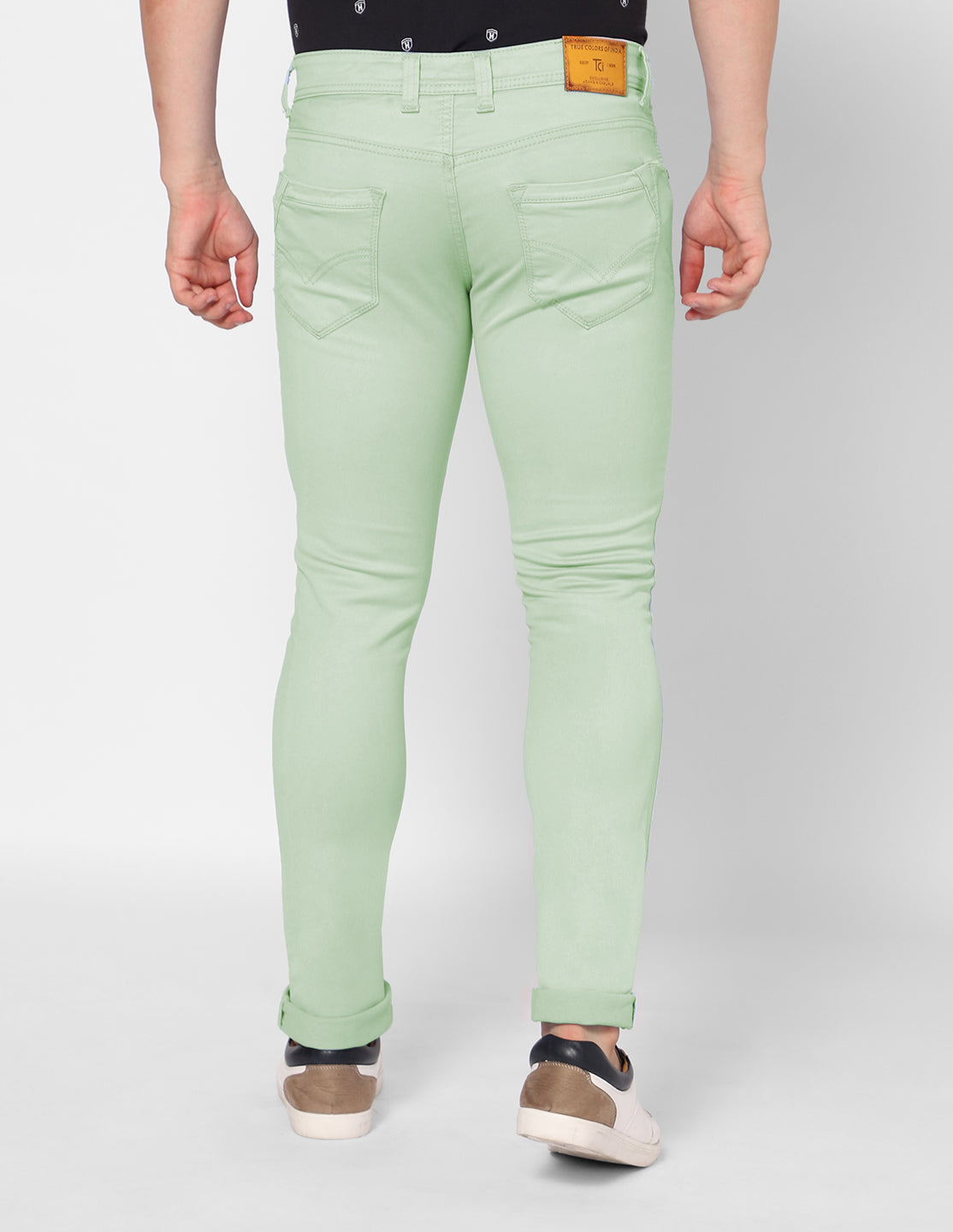 TCI Men’s Light Green Denim Jeans – Back view showcasing the comfortable pockets and overall fit.