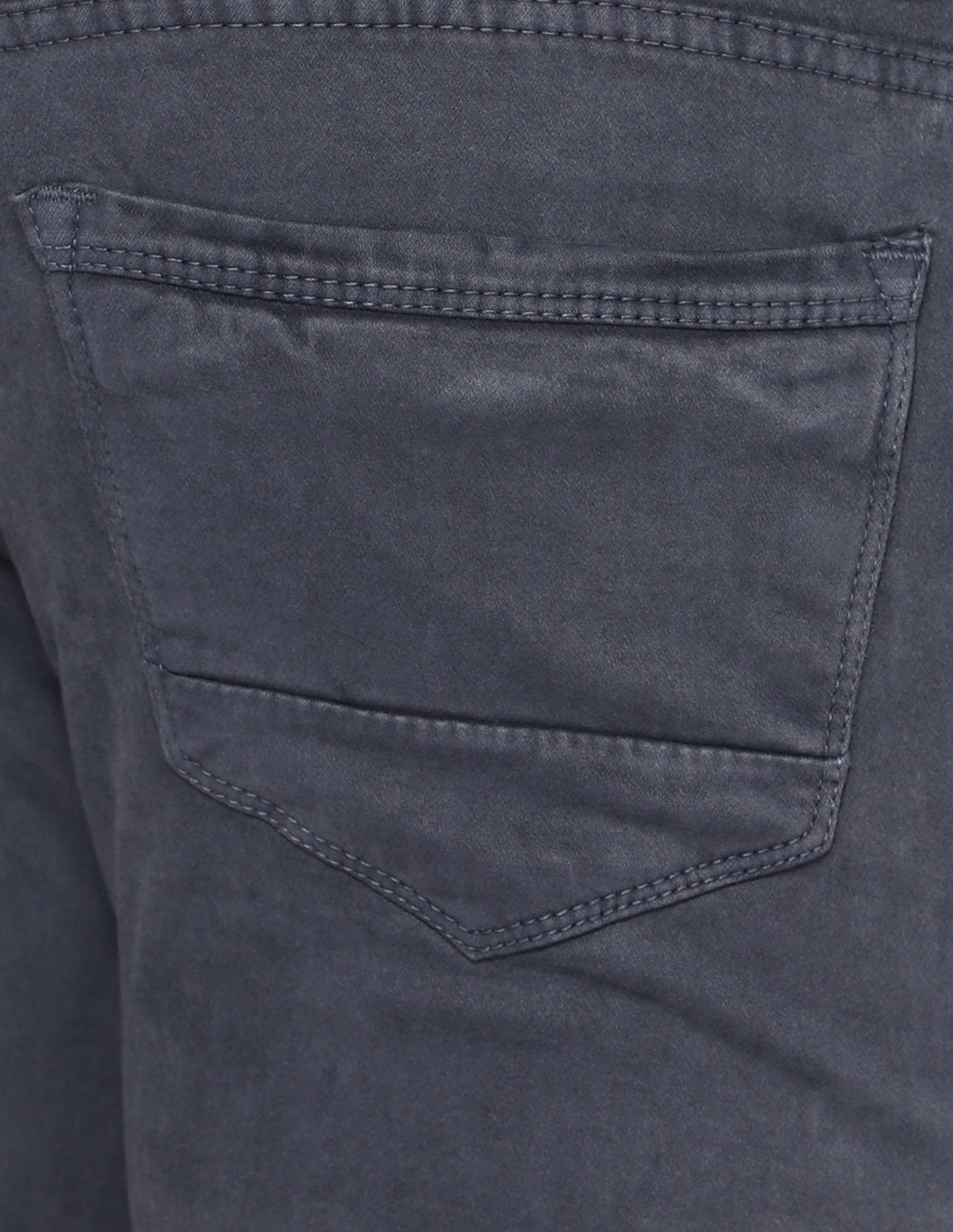 Detailed view of the comfortable front and back pockets on TCI Men’s Grey Denim Jeans.