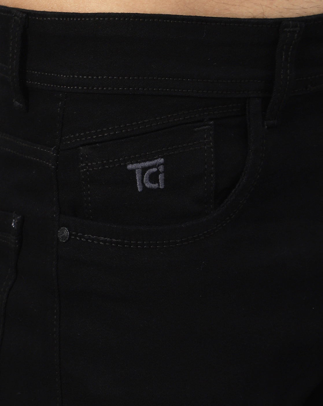 Close-up of the stretchable fabric of True Colors of India®️ (TCI) Men’s Black Denim Jeans, demonstrating its quality and durability.