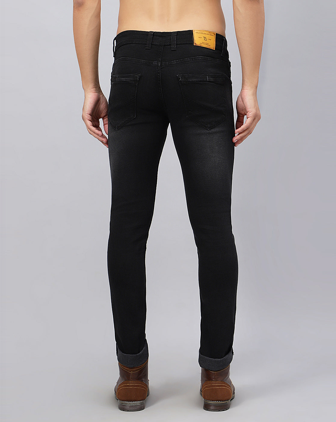 Back view of TCI Men's Stylish Black Denim Jeans highlighting the regular fit and pocket details.