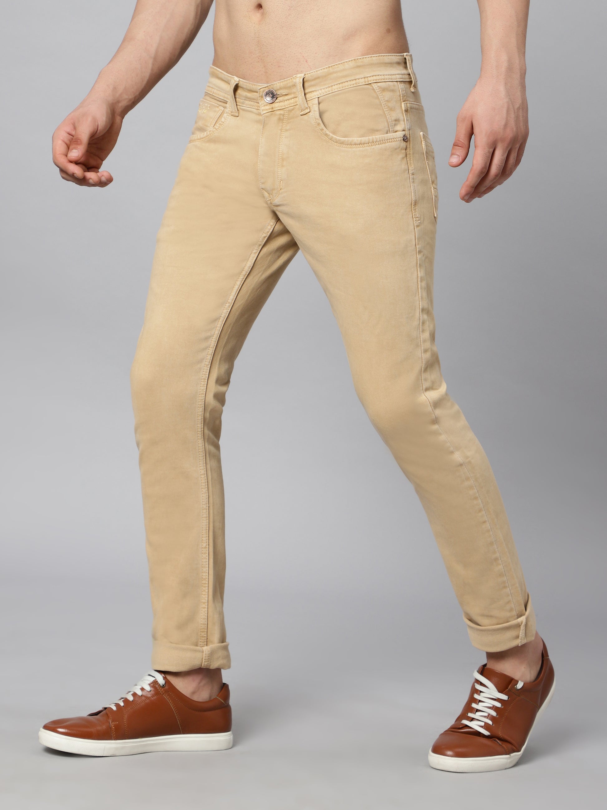 TCI Men’s Beige (Fawn) Jeans – Side view demonstrating the slim silhouette and mid-rise cut.