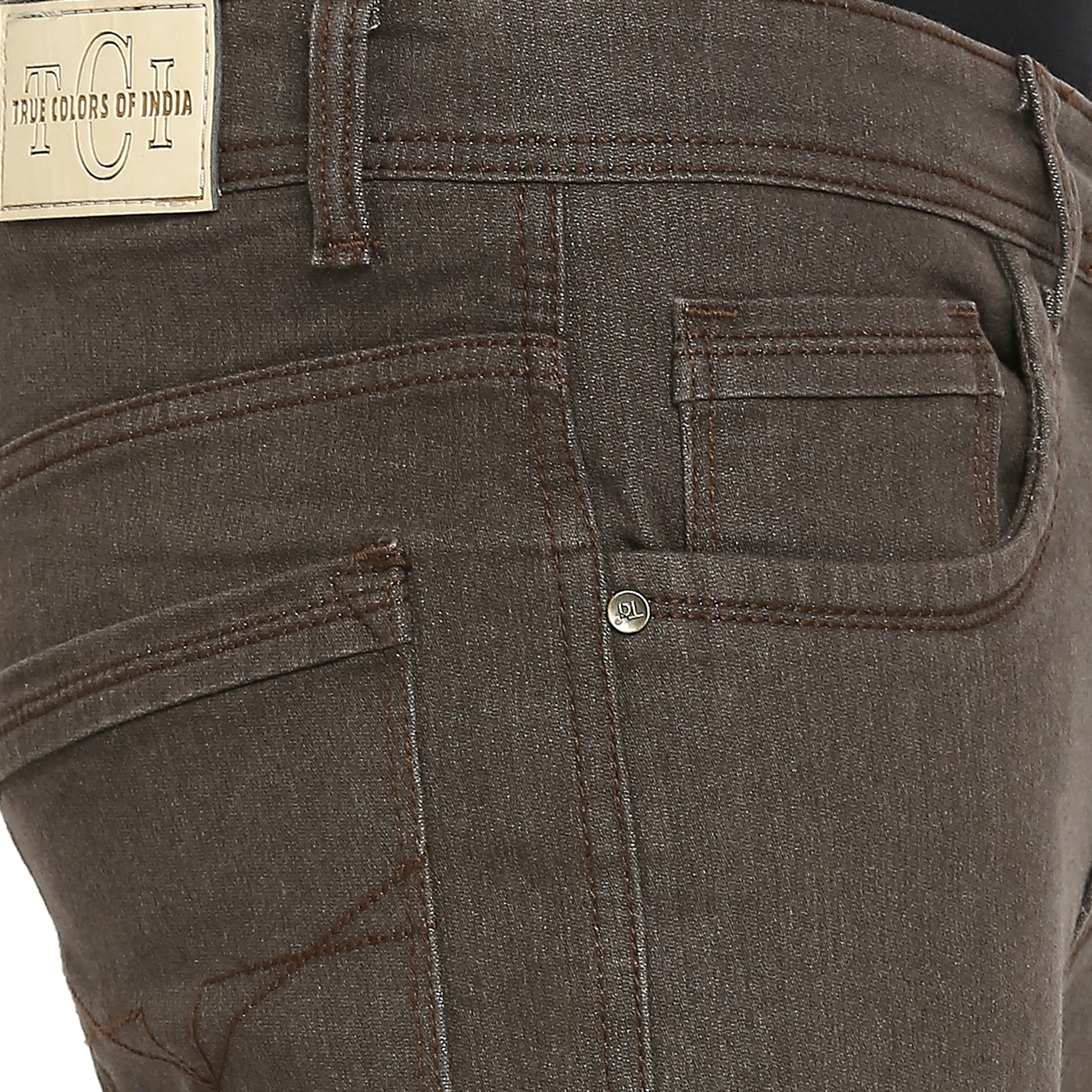 Close-up of the front side pocket and coin pocket of TCI Men’s Dark Brown Slim Fit Jeans. The image details the stitching, pocket design, and the small coin pocket integrated into the larger front pocket.