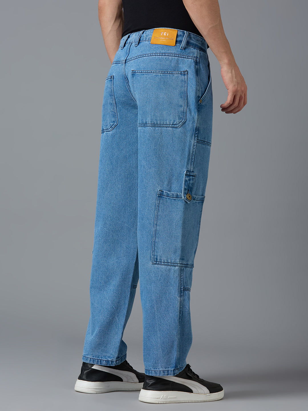 Back view of TCI Men's Light Blue Cargo Jeans - Classic Denim Look with Pockets