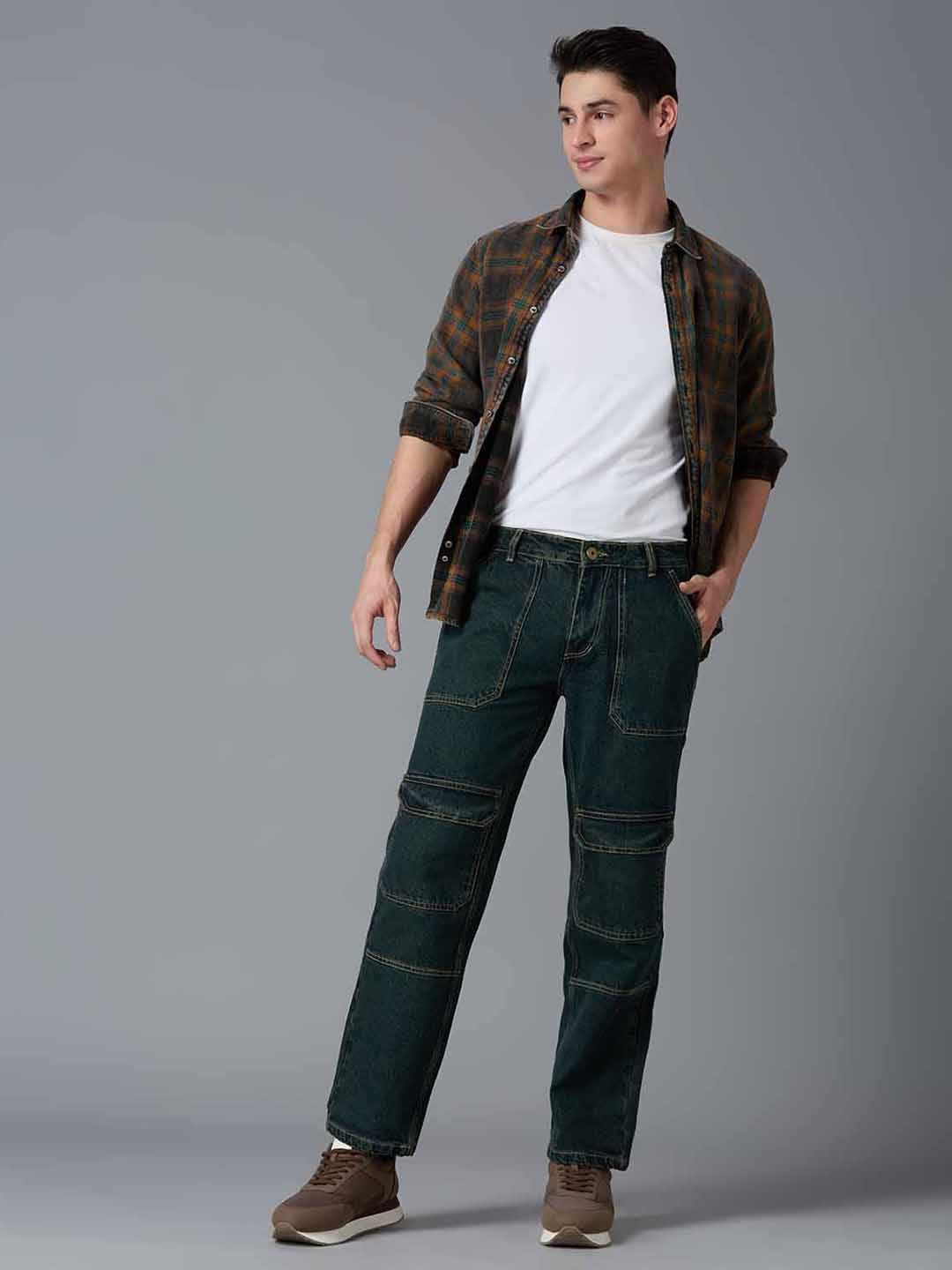 Model styling TCI Men's Green Denim Cargo Pants with a Plaid Shirt & Sneakers - Trendy Streetwear Look