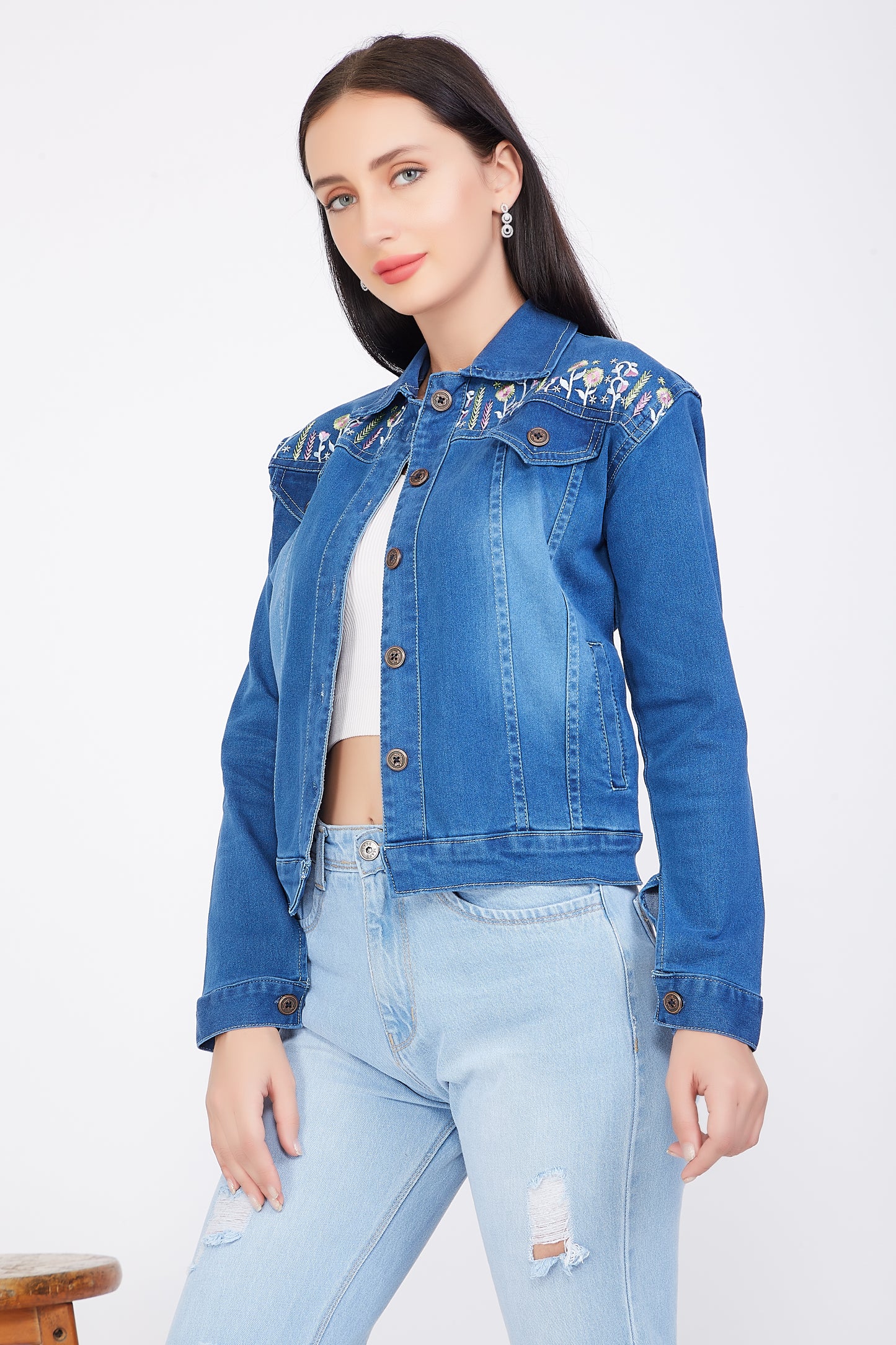 Right side view of a model wearing Cefalu®️ Women’s Blue Denim Jacket, showing the jacket’s silhouette and embroidery