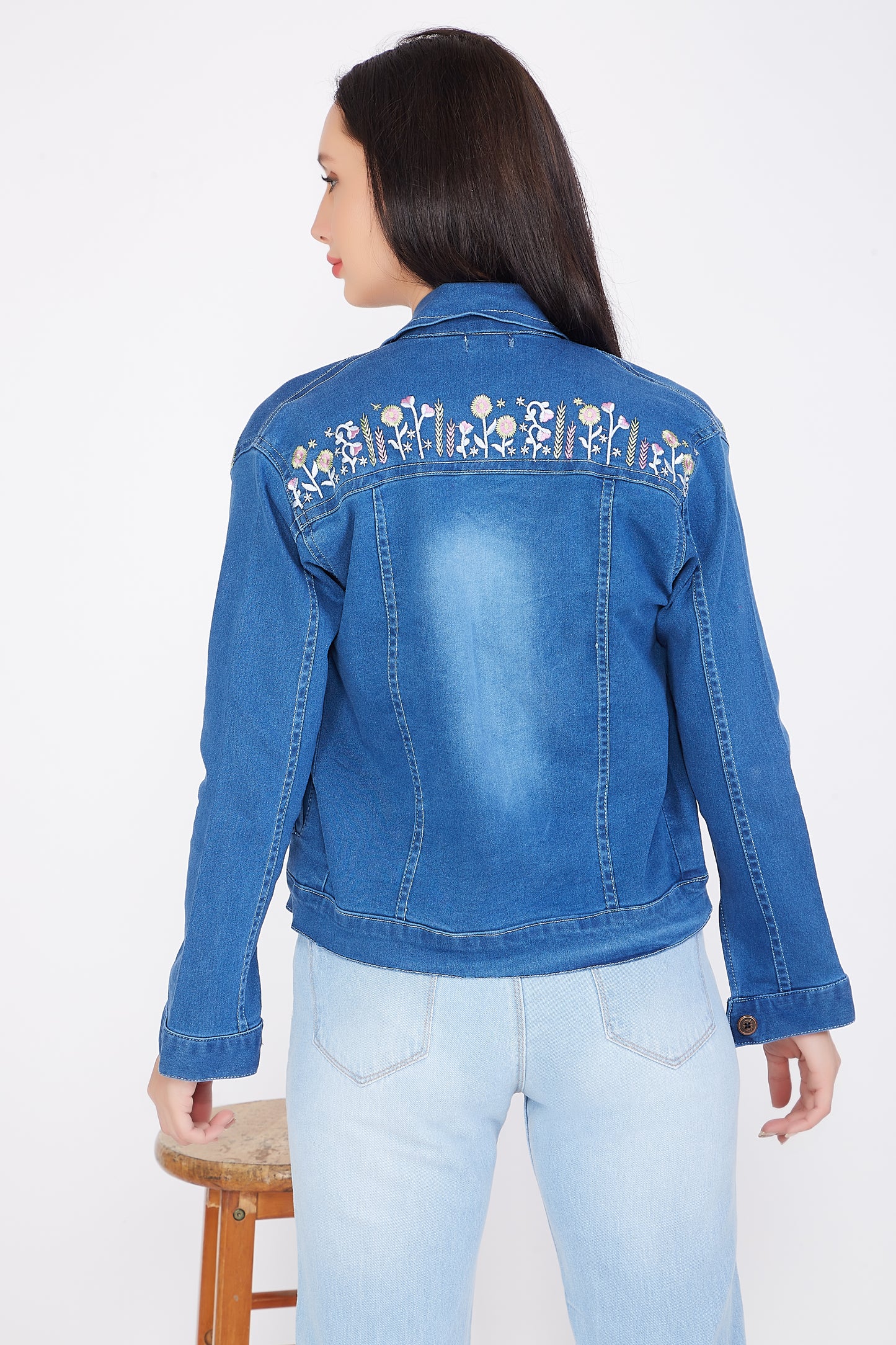 Back view of a model showcasing Cefalu®️ Women’s Blue Denim Jacket with embroidered detail