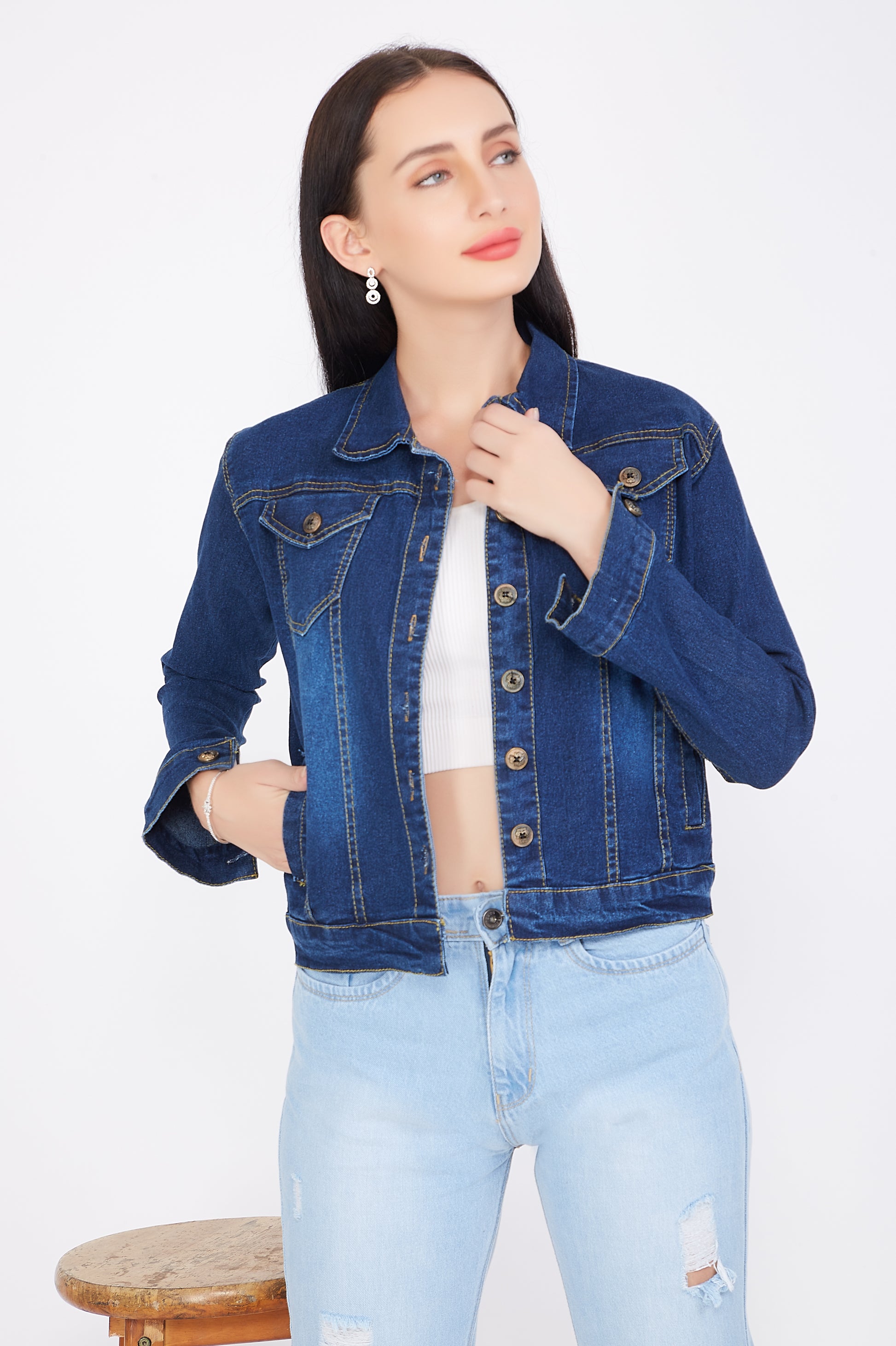 Right side view of a model wearing Cefalu®️ Women’s Dark Blue Denim Jacket, showing the full sleeve design and stand collar