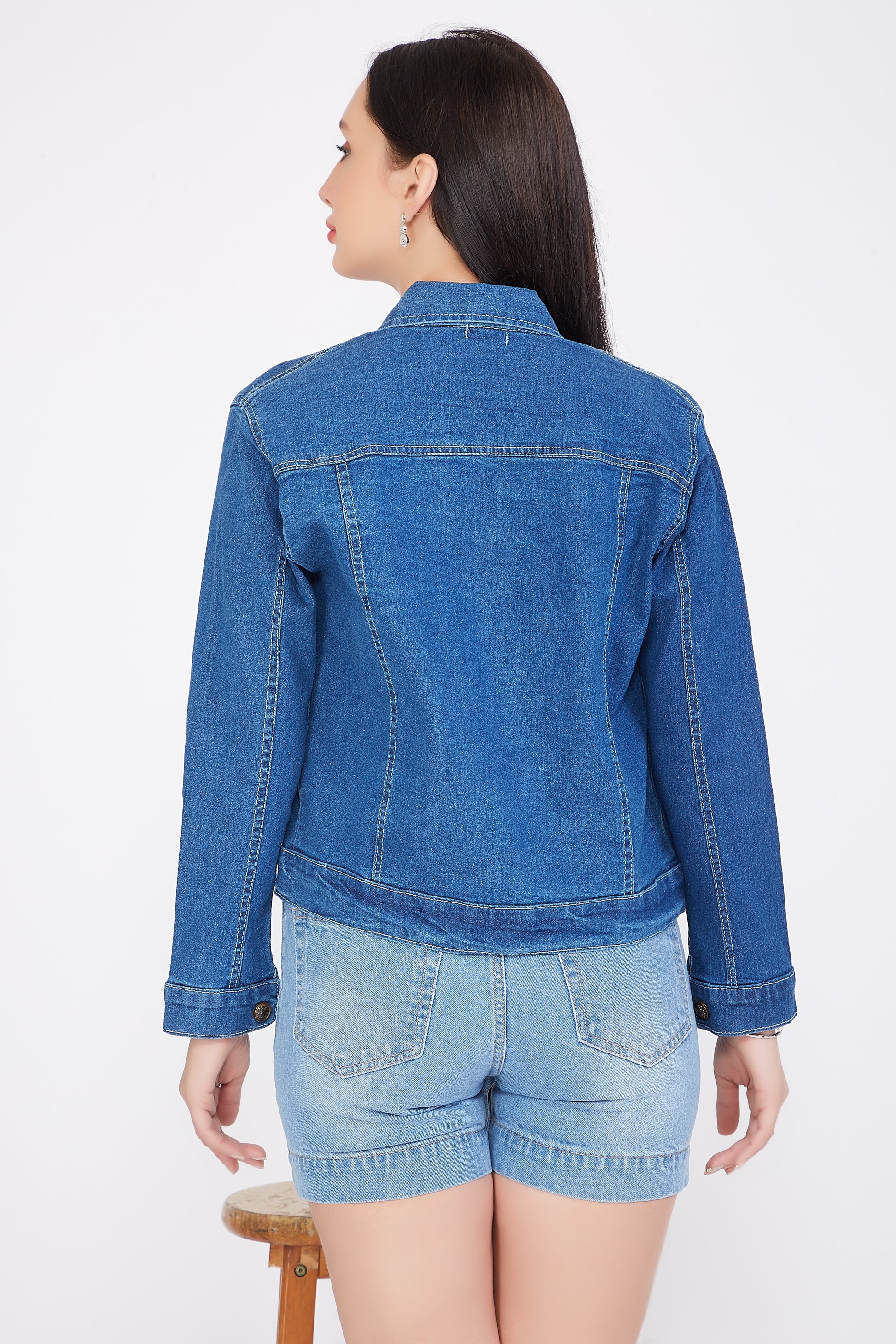 Back view of a model showcasing Cefalu®️ Women’s Solid Blue Denim Jacket with a classic design and full sleeves