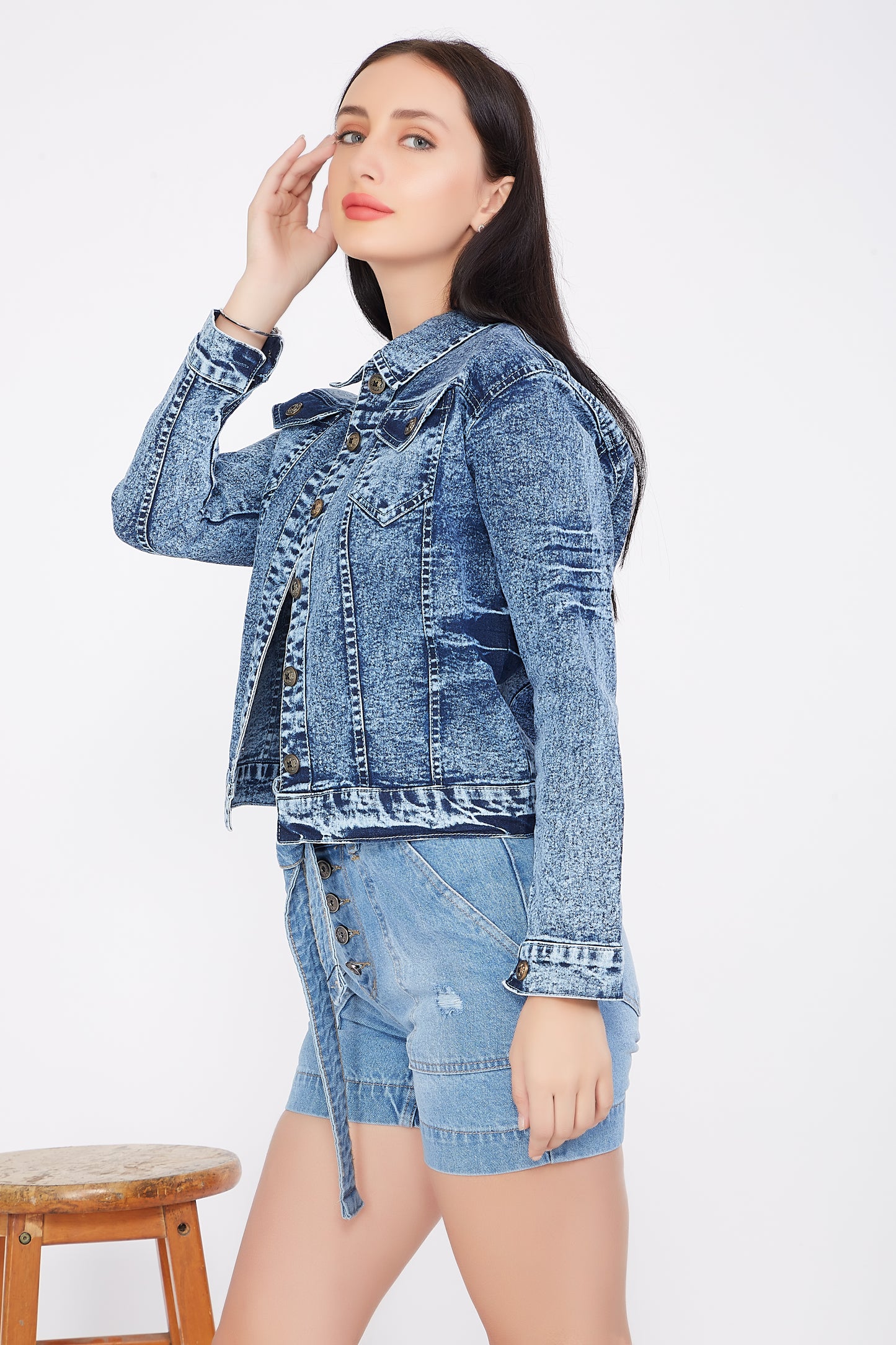 Left side view of a model in Cefalu®️ Cloud Blue Denim Jacket for Women, highlighting the jacket’s full sleeves and fit