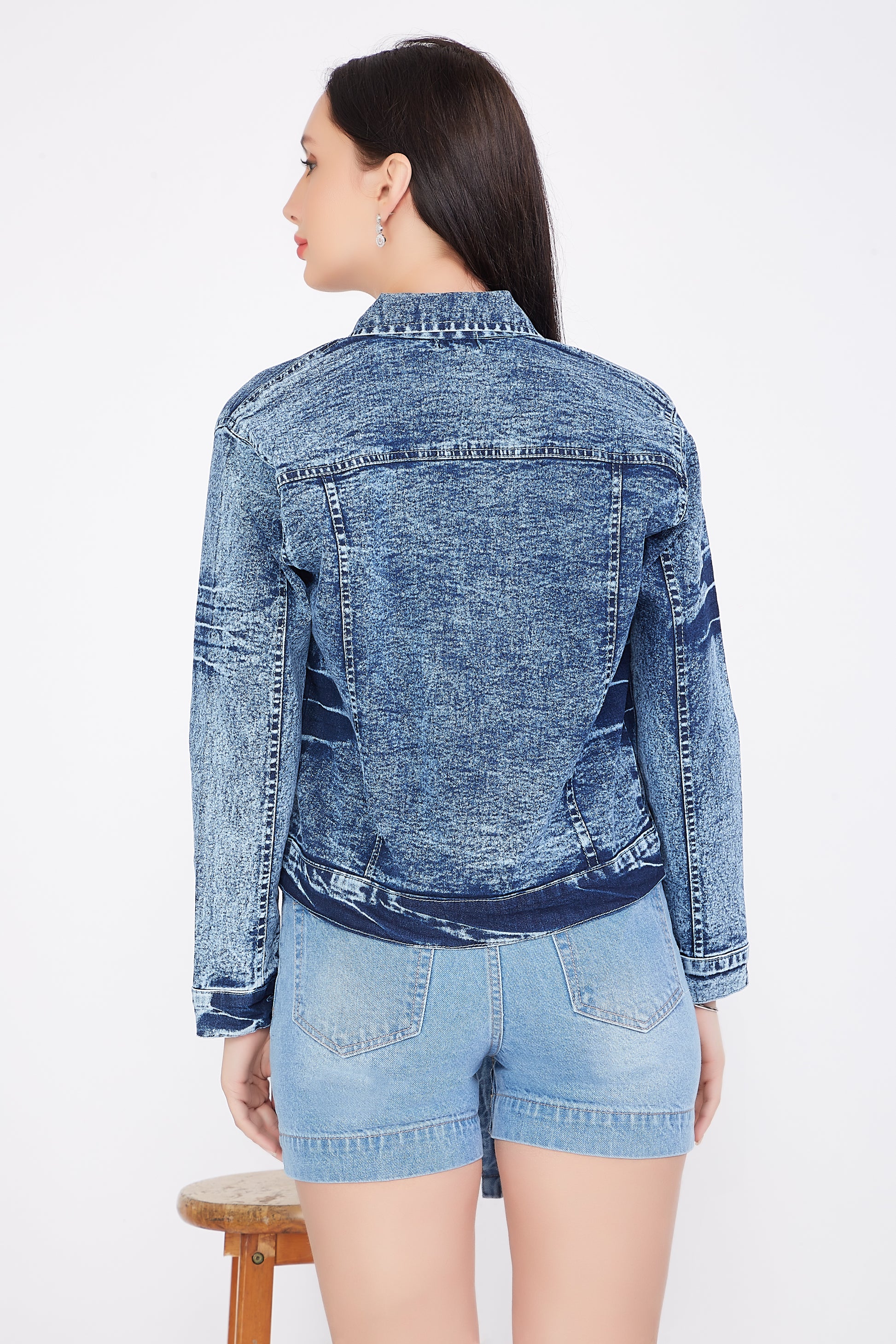 Back view of a model showcasing Cefalu®️ Women’s Cloud Blue Denim Jacket with a solid design and stand collar