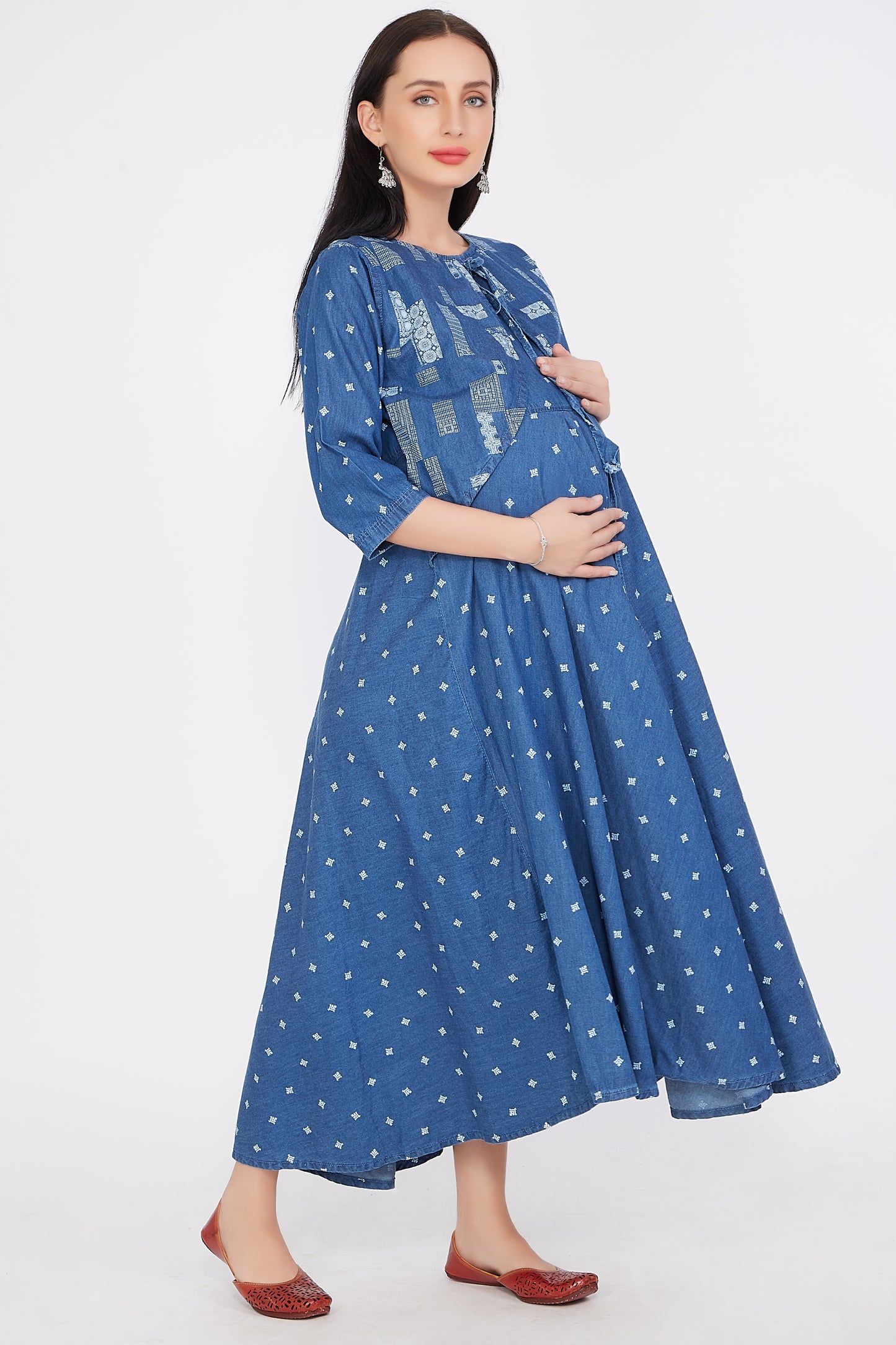 Side view of Cefalu®️ Women’s Blue Maternity Dress, focusing on the flared design and how it adapts to a growing bump.