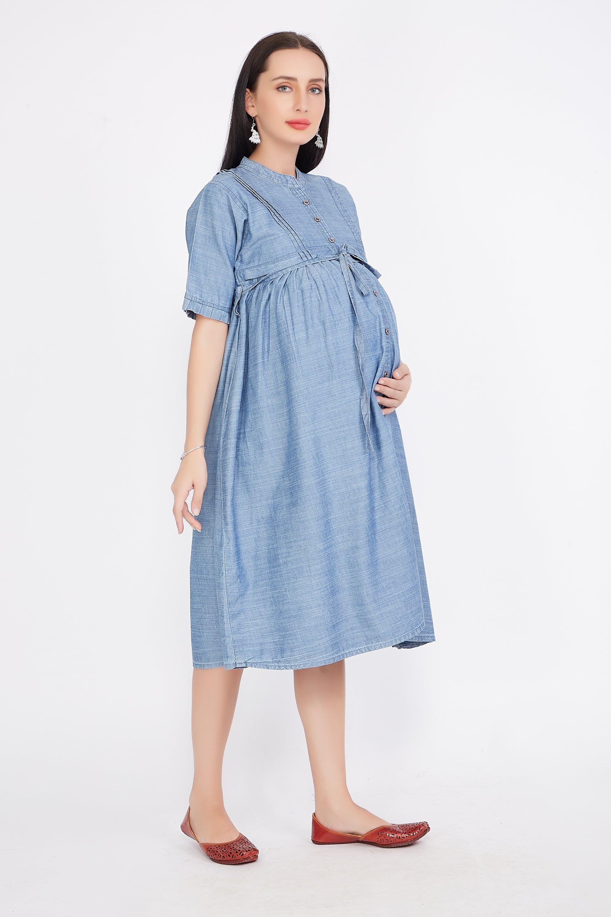 Left side view of Cefalu®️ Women’s Light Blue Maternity Dress, emphasizing the soft denim belt and overall fit.