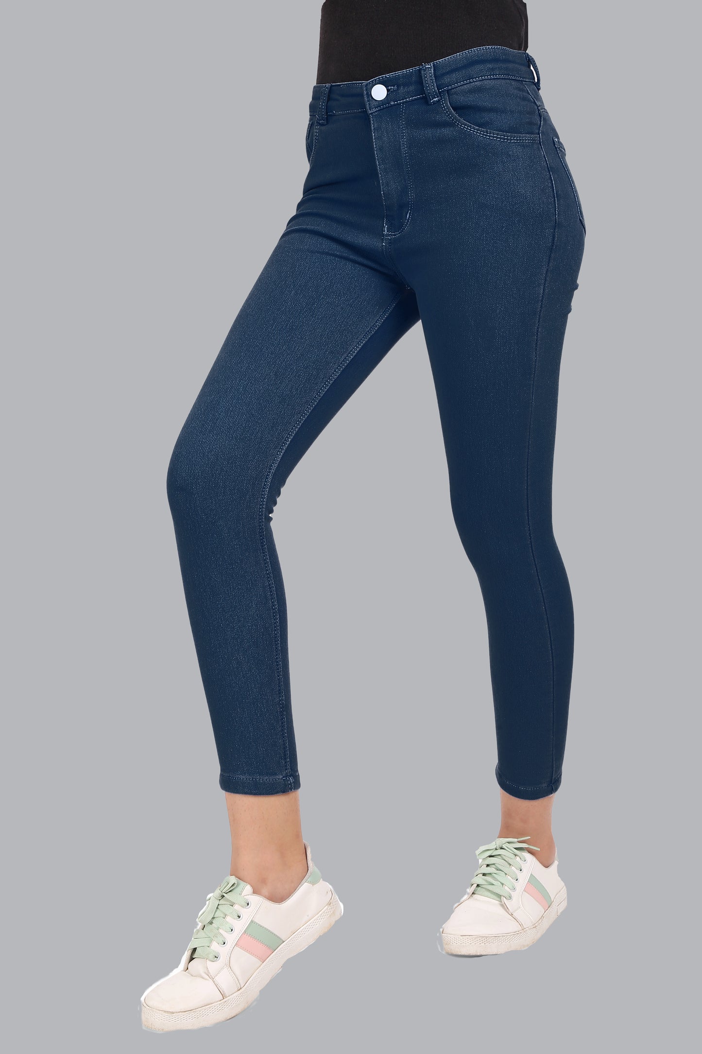 Side view of Cefalu Women’s Electric Blue Skinny Jeans, displaying the skinny fit and contouring design. The vibrant color and clean lines of the jeans are emphasized.