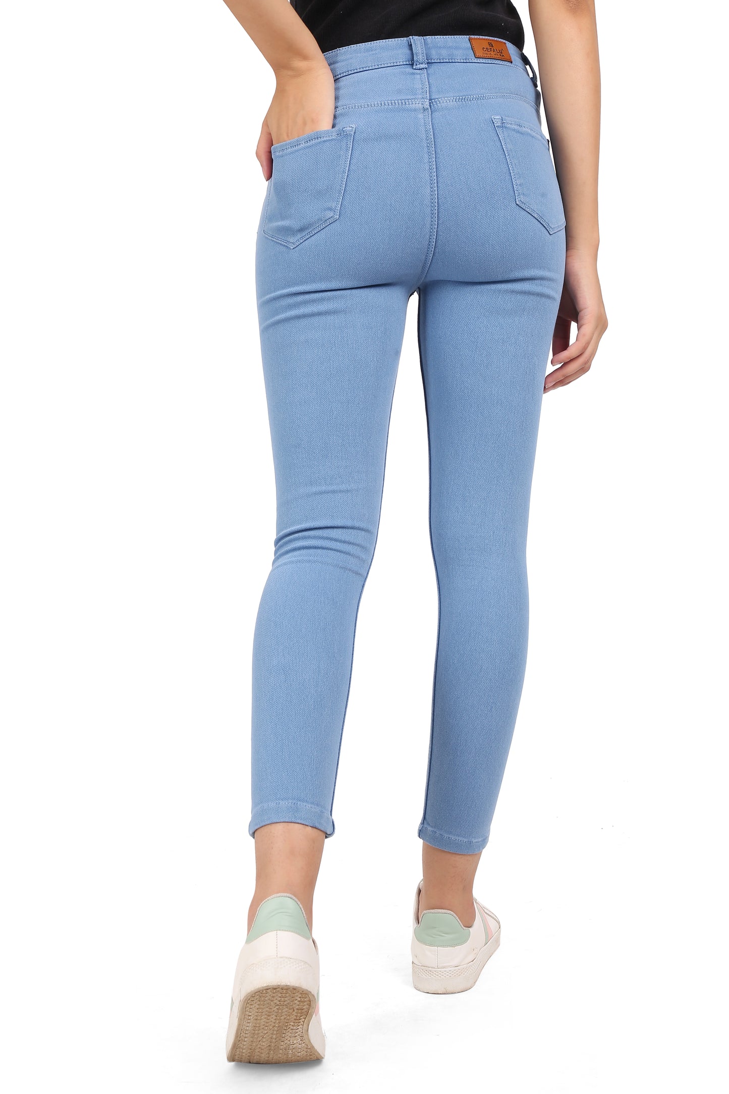 Back view of Cefalu®️ Women’s Light Blue Skinny Jeans, highlighting the solid light blue color and the simple, elegant design.